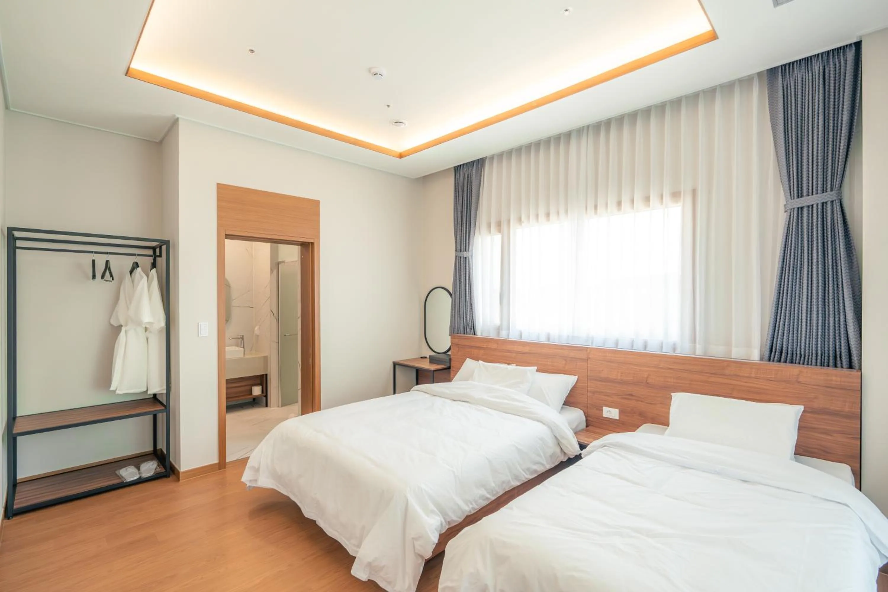 Bed in Dongho Beach Hotel