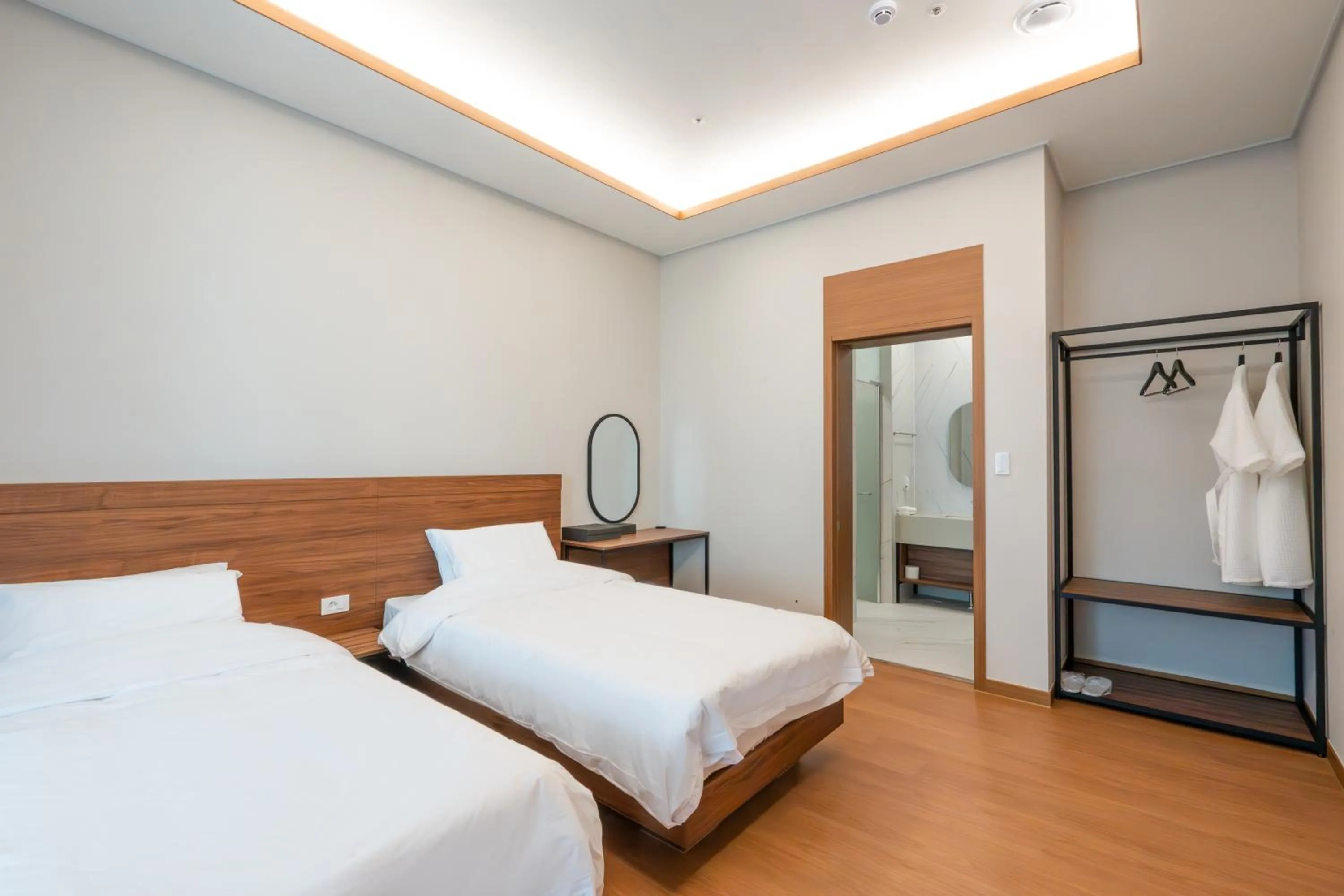 Bed in Dongho Beach Hotel