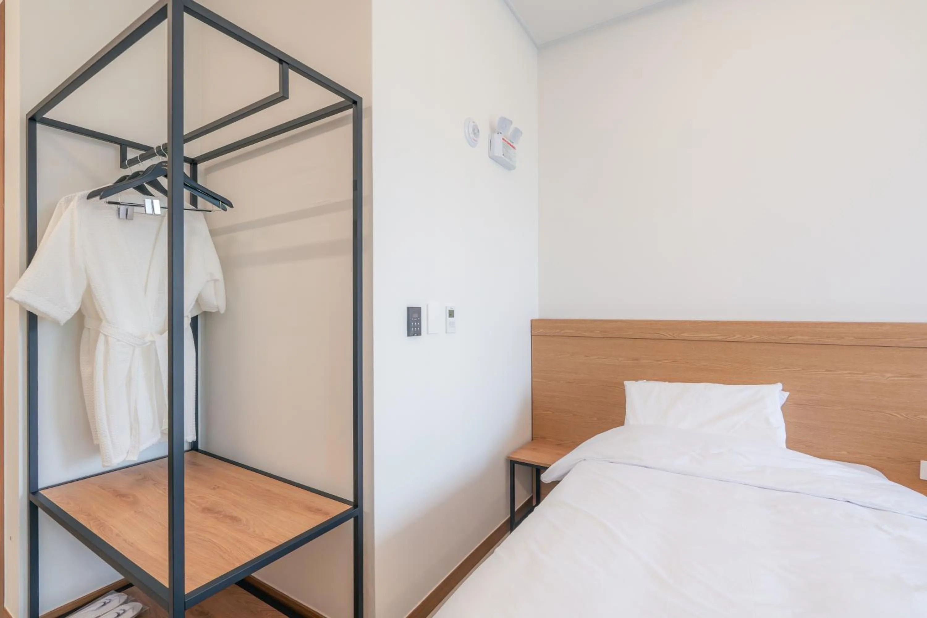 Bed in Dongho Beach Hotel