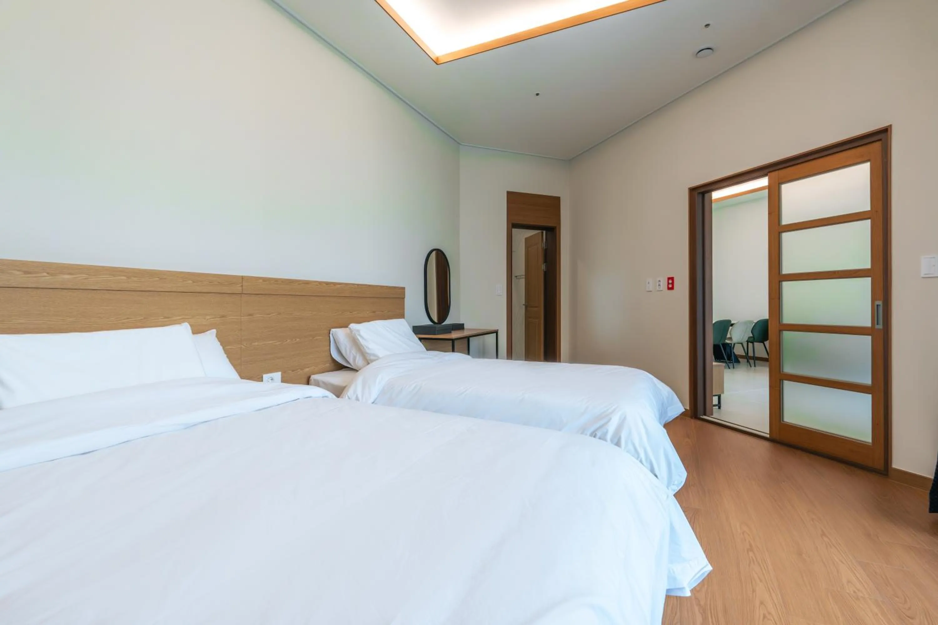 Bed in Dongho Beach Hotel