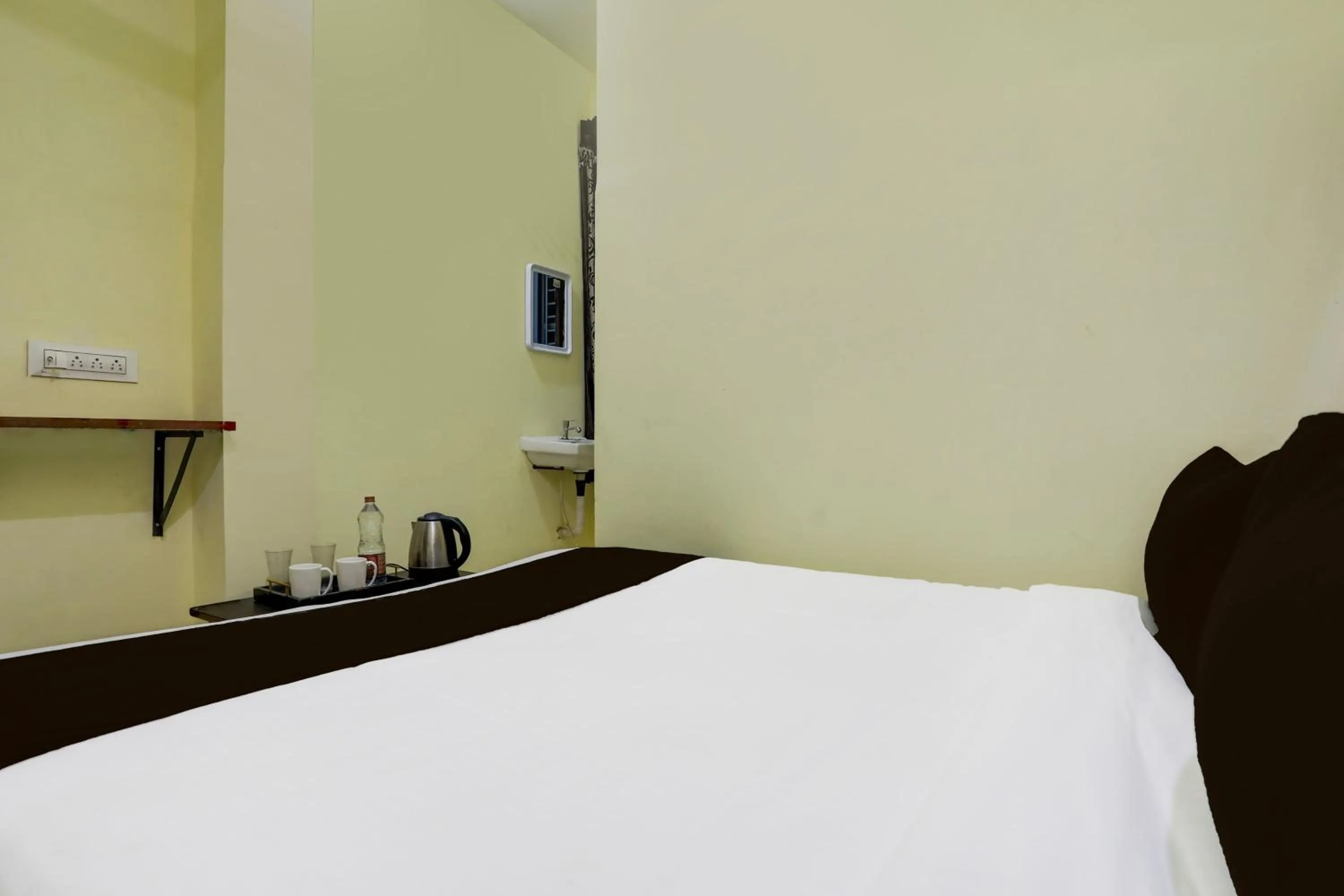 Bedroom, Bed in SPOT ON SRI KARTHIK GRAND INN