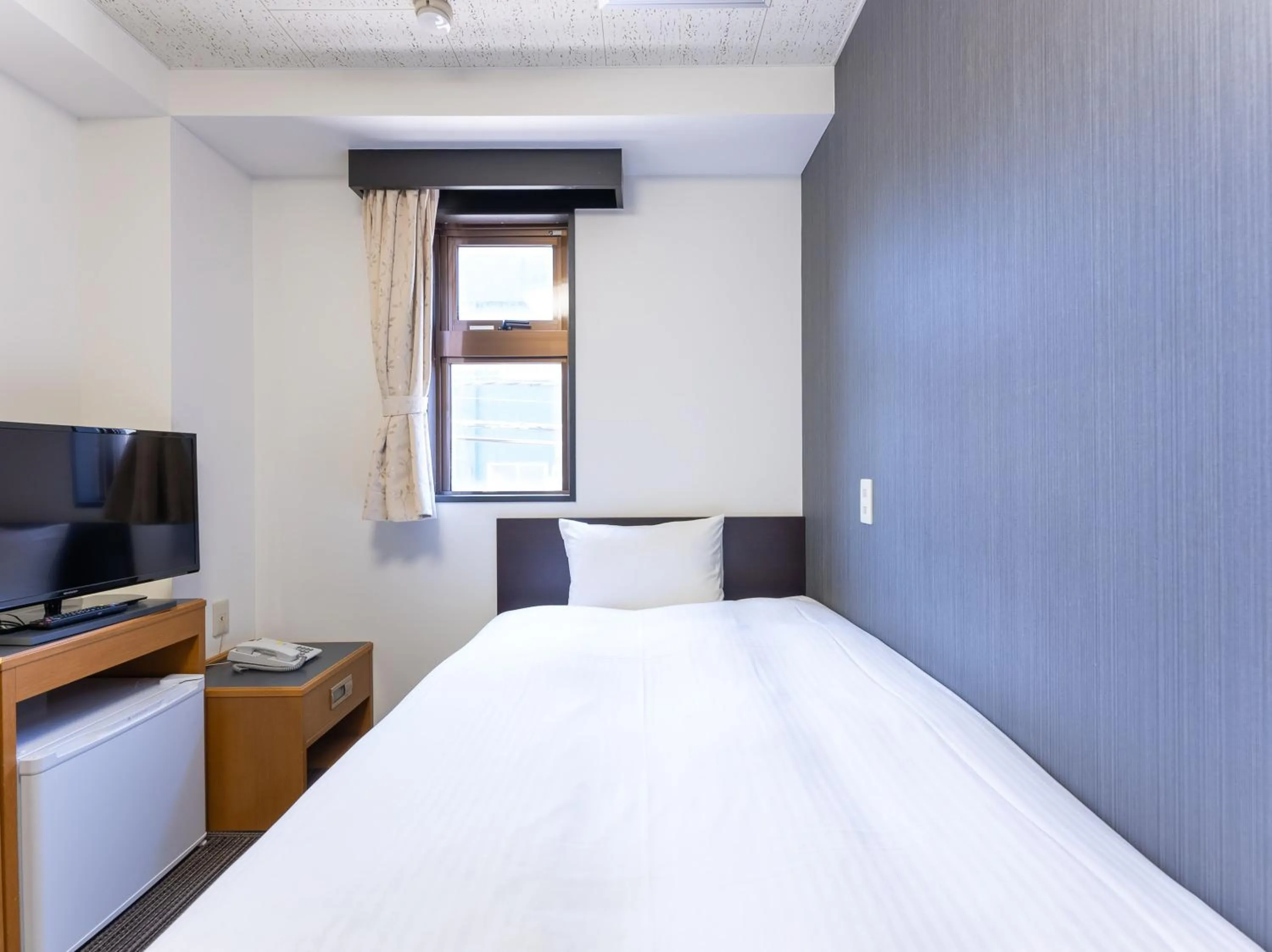 Bed in Noshiro Town Hotel Minami