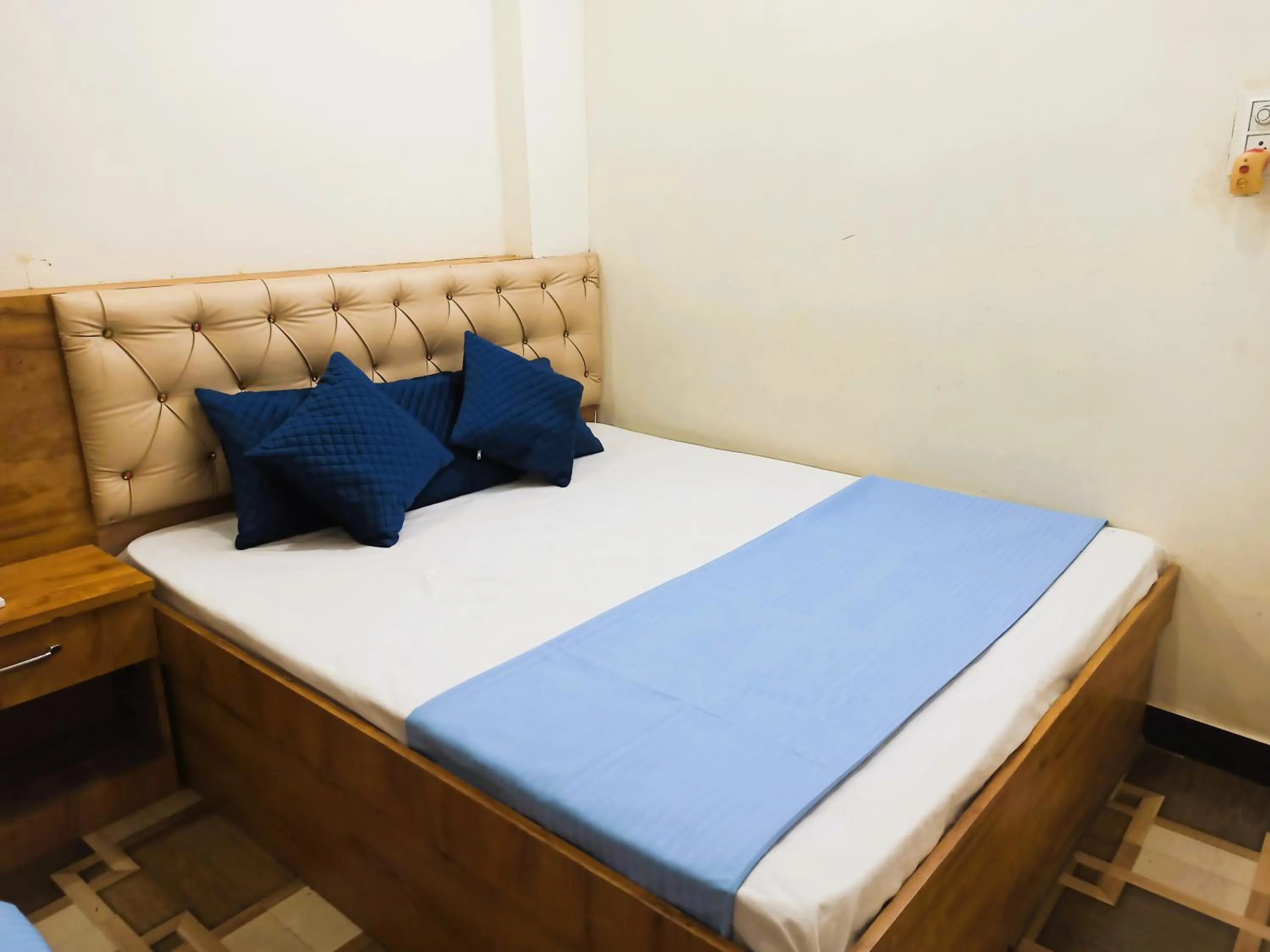 Bed in Hotel Yuvan Palace