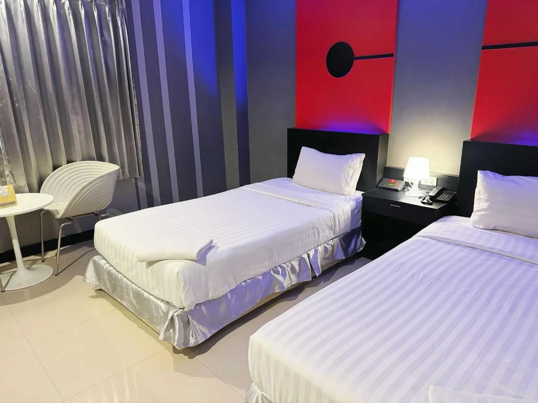 Bedroom in Capital O 75514 Vasidtee City Hotel (Suphanburi)