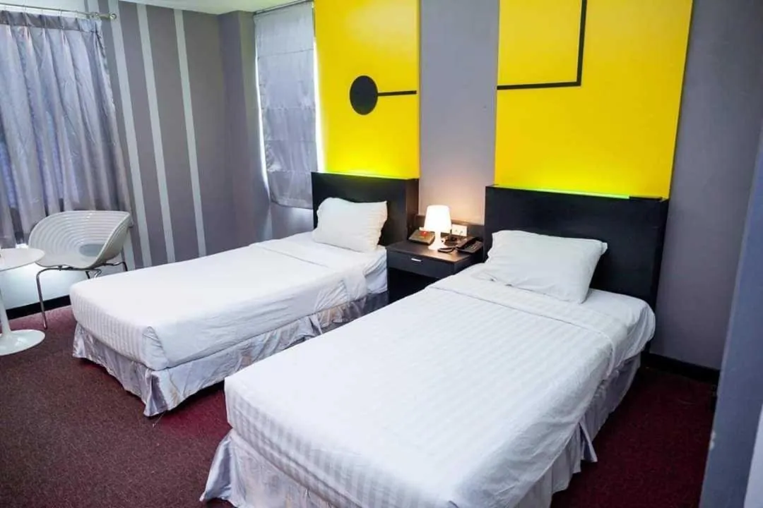 Bedroom in Capital O 75514 Vasidtee City Hotel (Suphanburi)