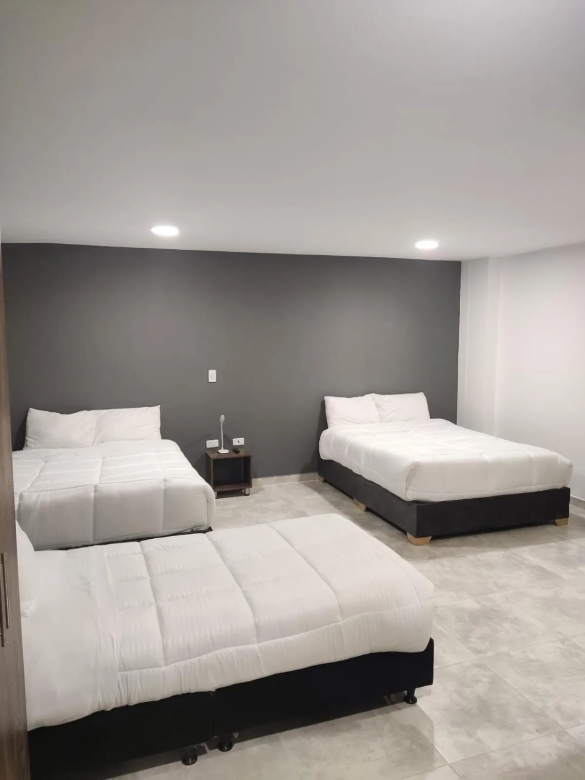 Bed in Xliving Host and Rooms