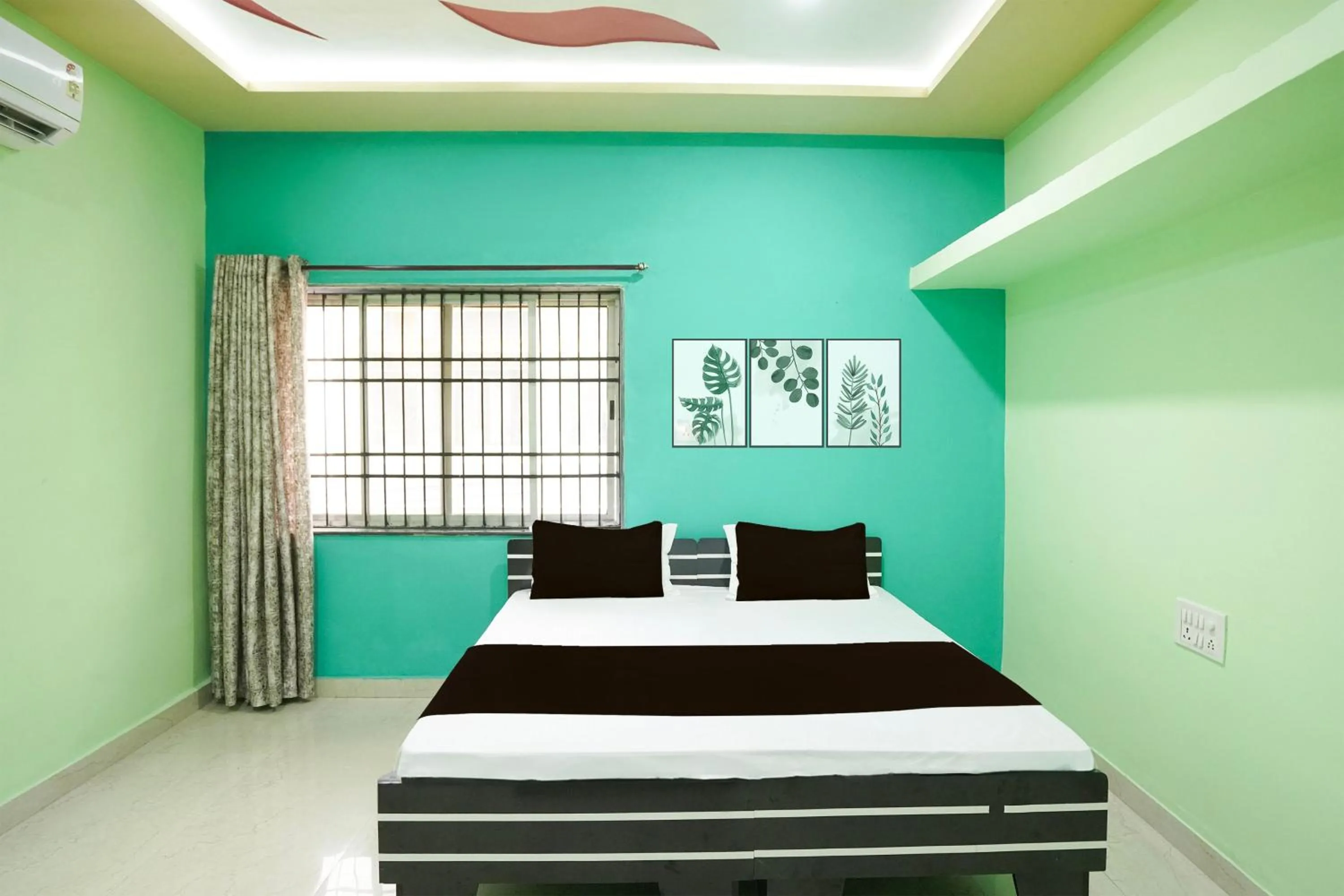 Bedroom in Hotel O Happy Hotel