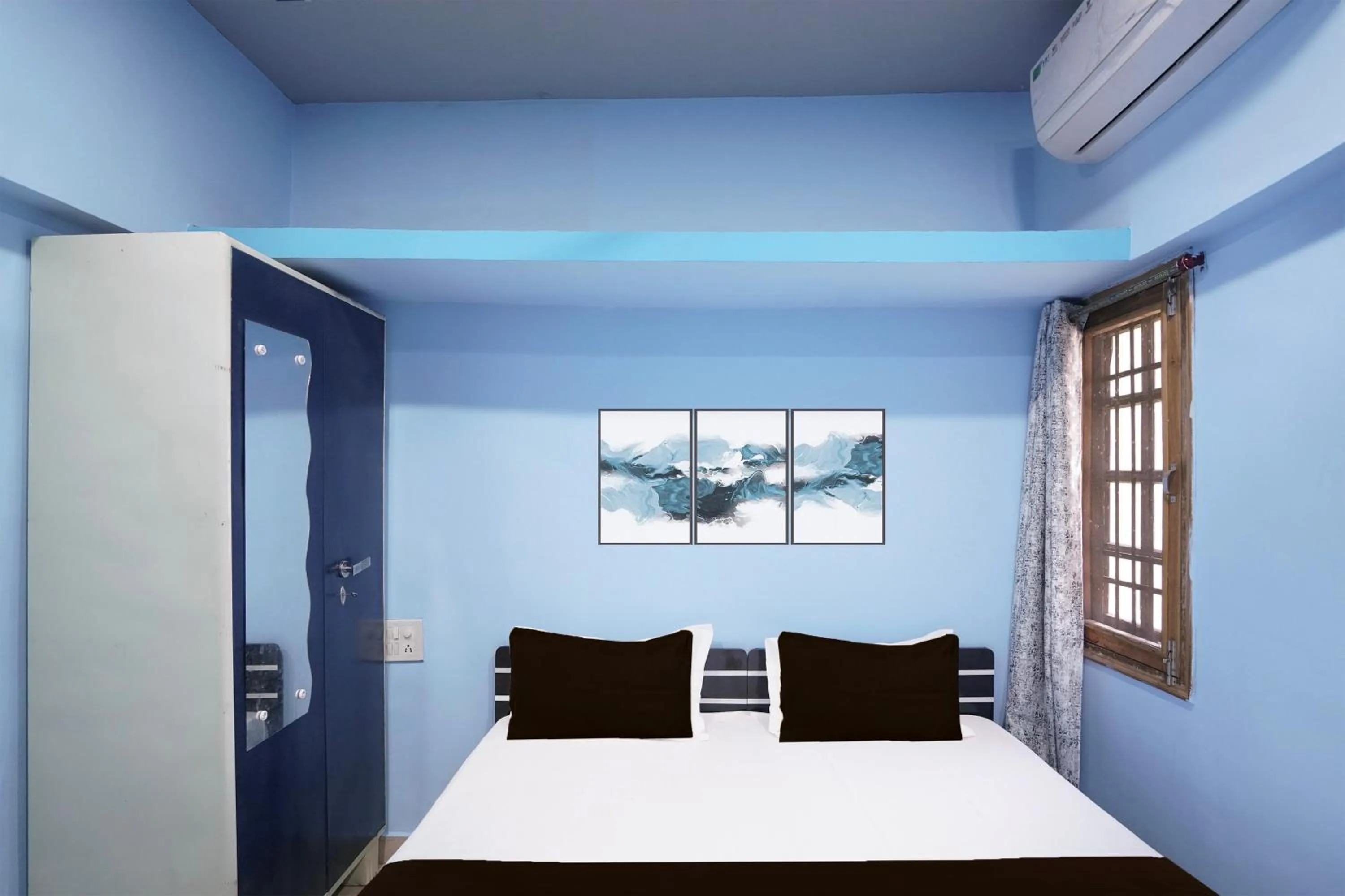 Bedroom in Hotel O Happy Hotel