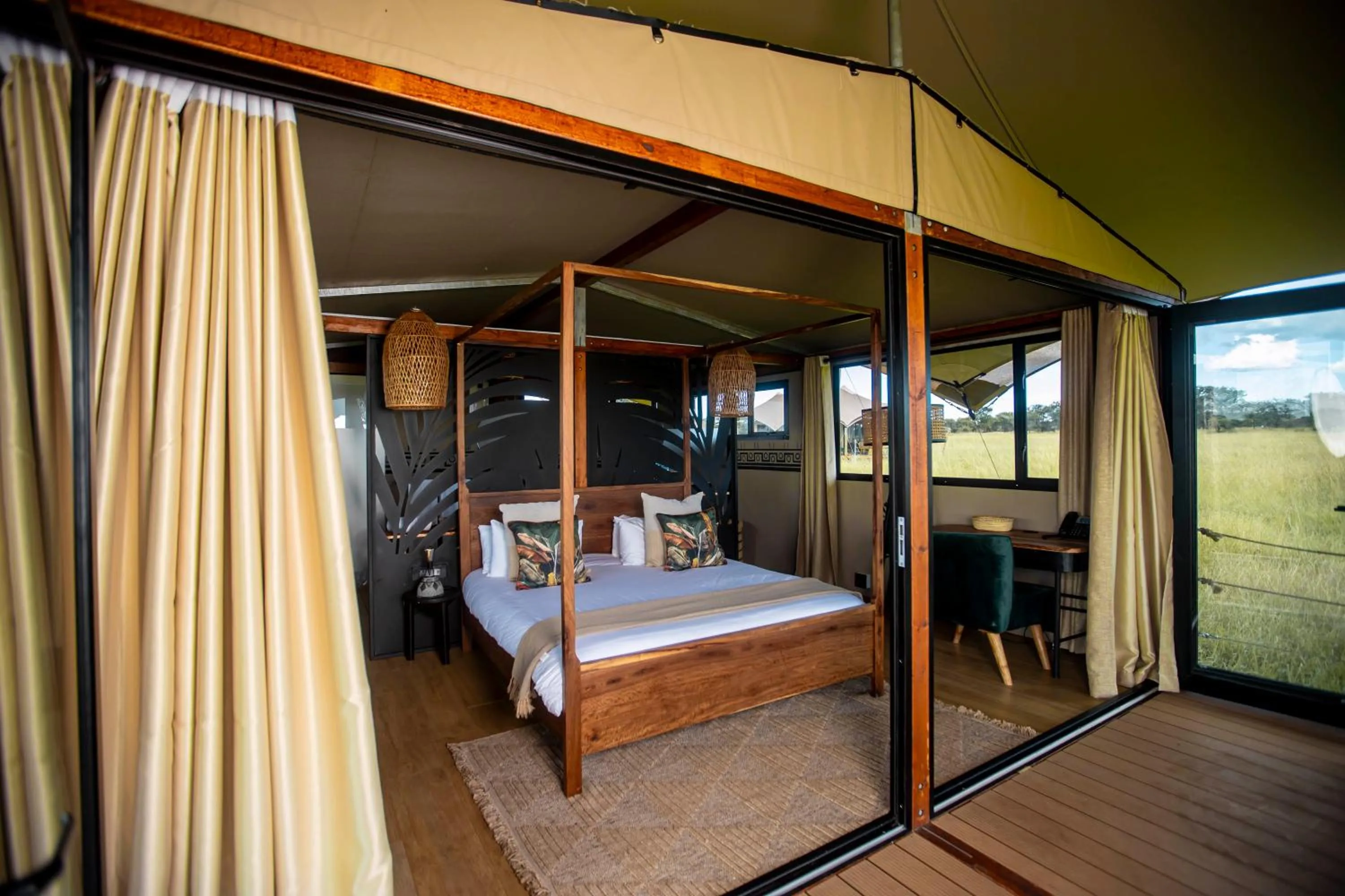 Property building, Bed in Escarpment Serengeti Luxury Camp