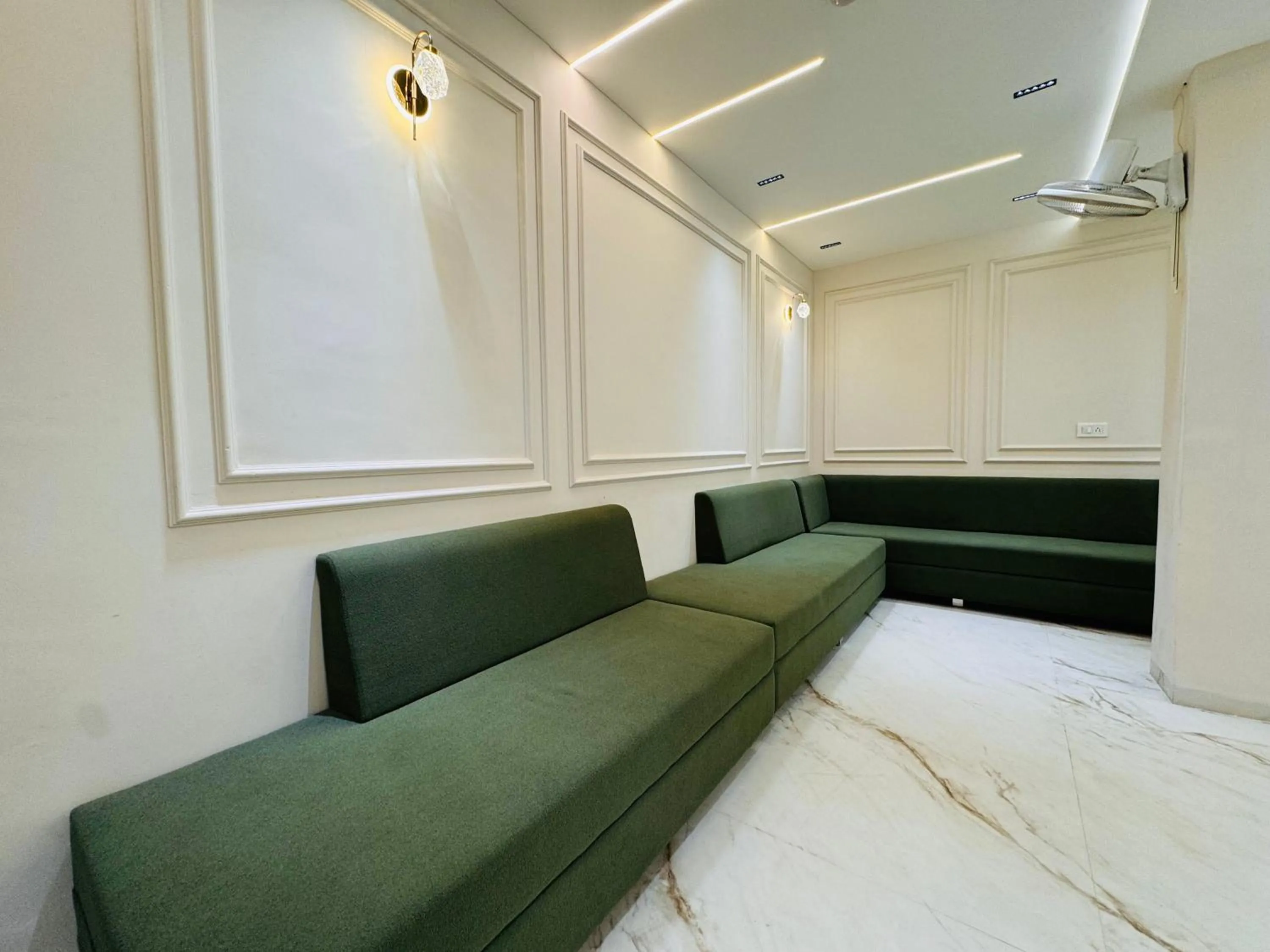 Seating area, Bed in Hotel Suryodaya