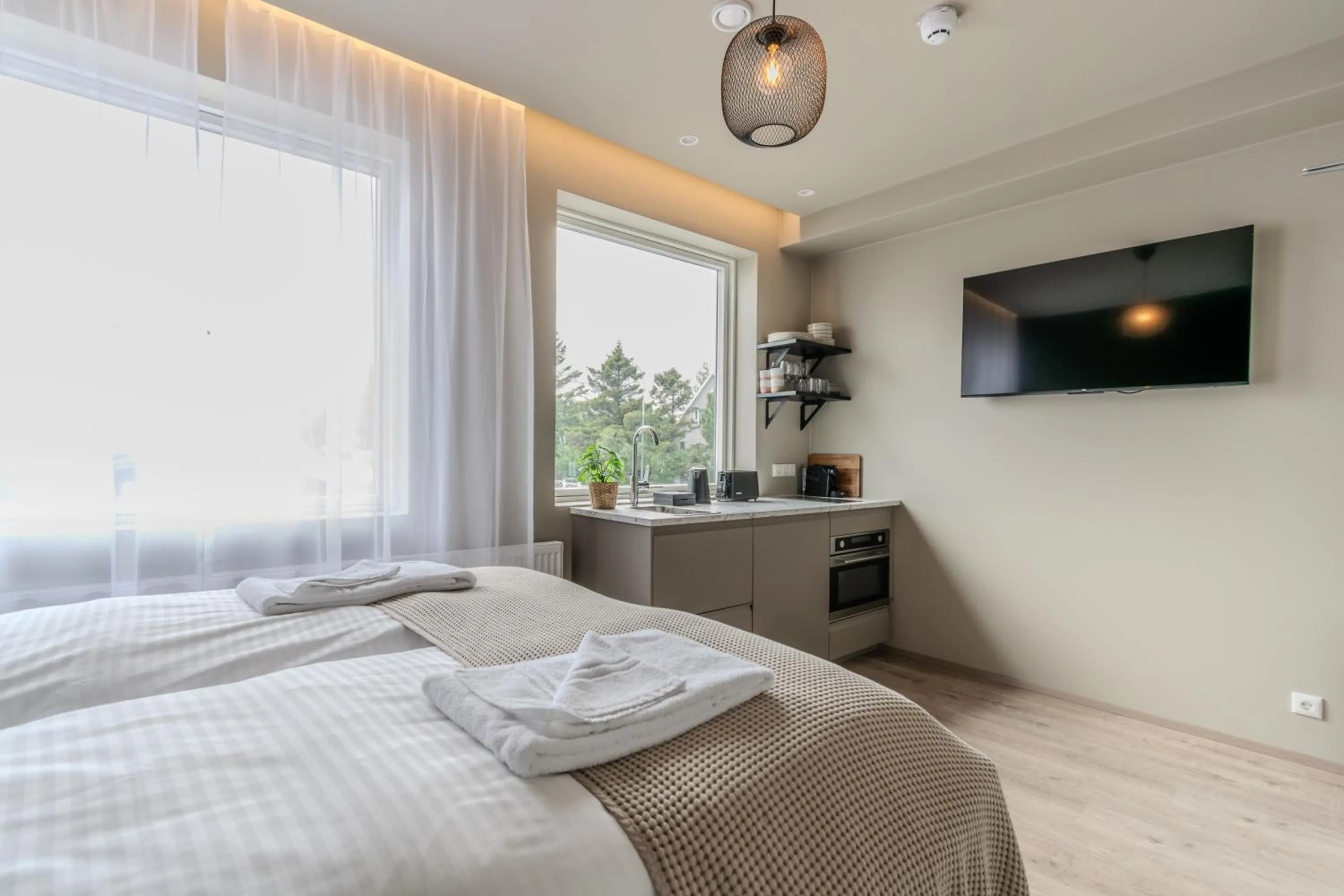 Bed in Frost Apartments by Heimaleiga