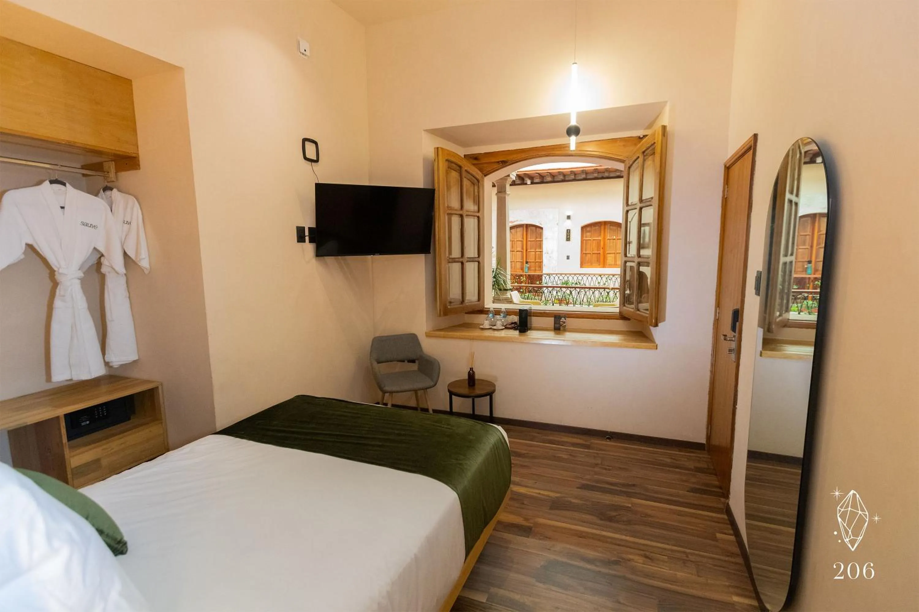 Photo of the whole room, Bed in Sauvé Casa Boutique