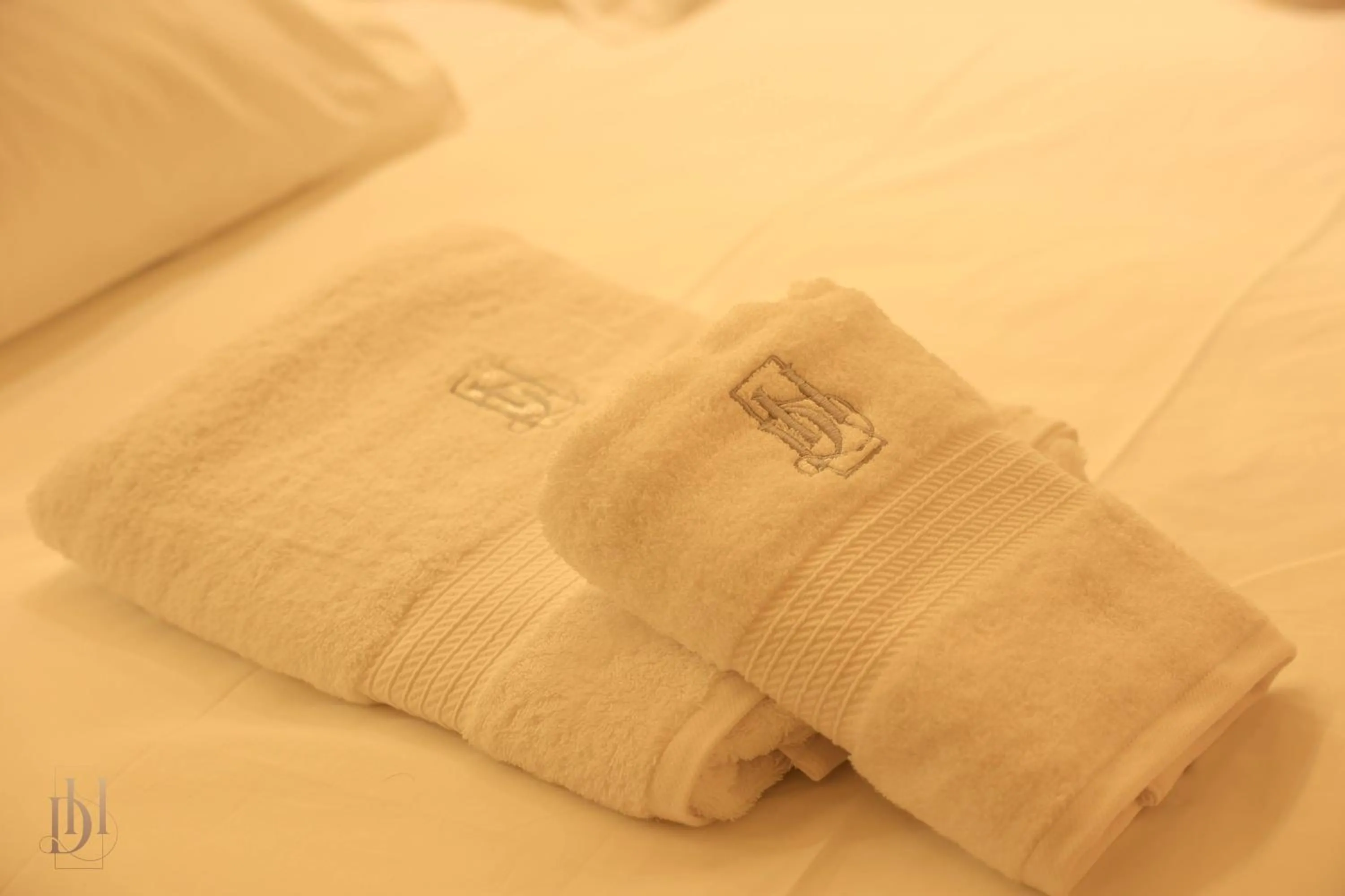towels, Bed in DeHa Rooms & Apartments