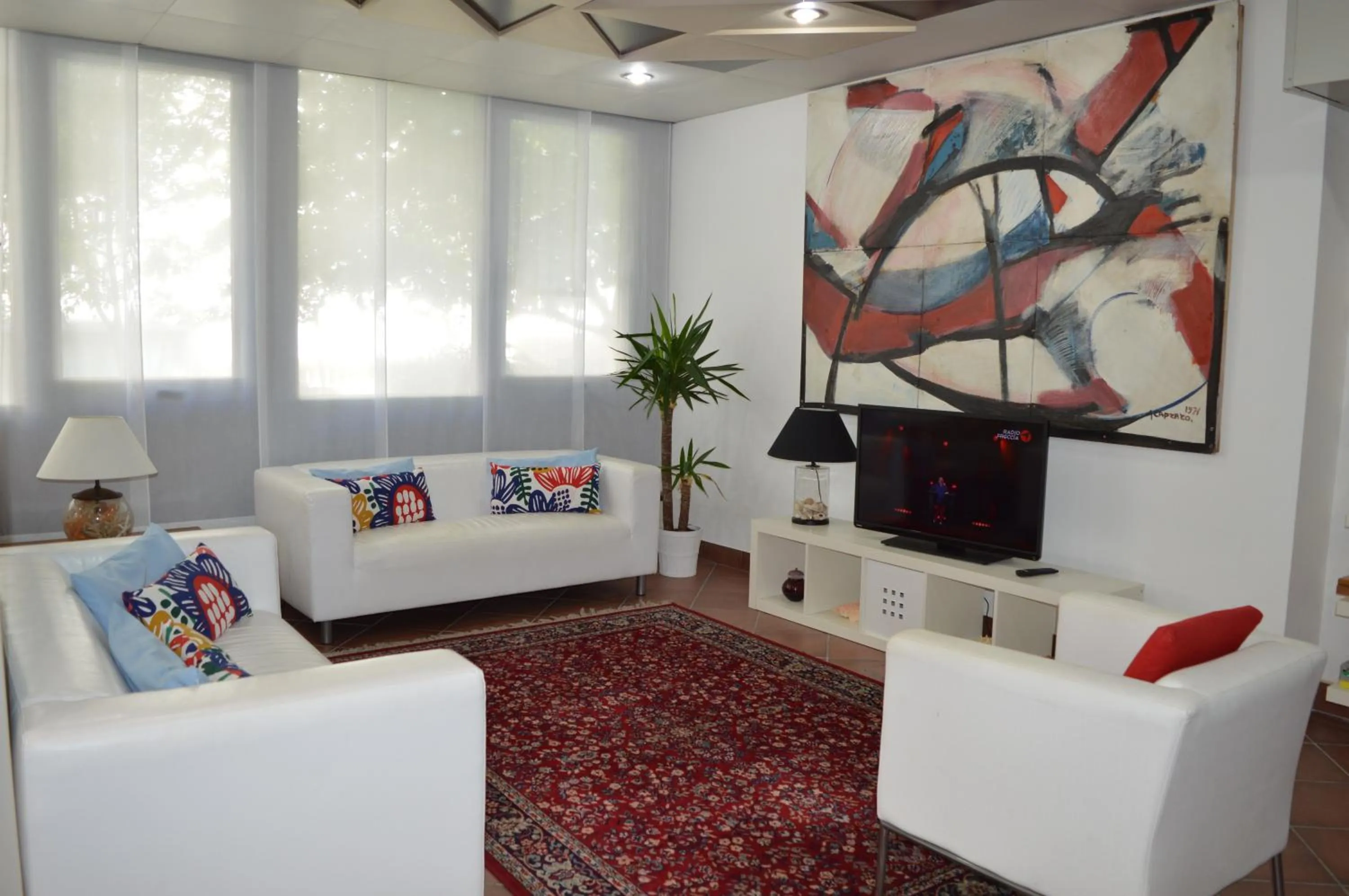 Communal lounge/ TV room in Hotel Merano