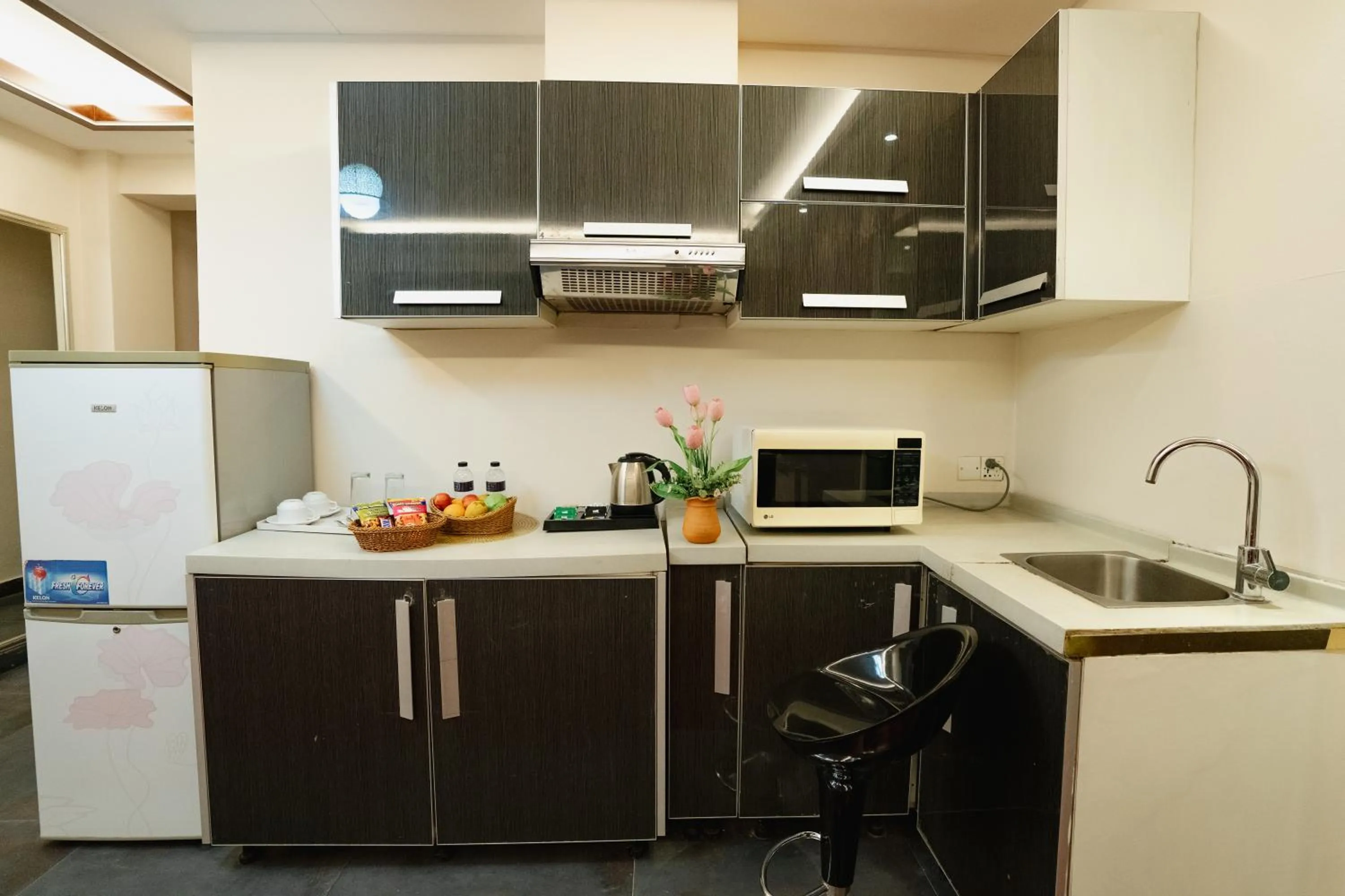 Kitchen or kitchenette in Royal Residence Dhaka