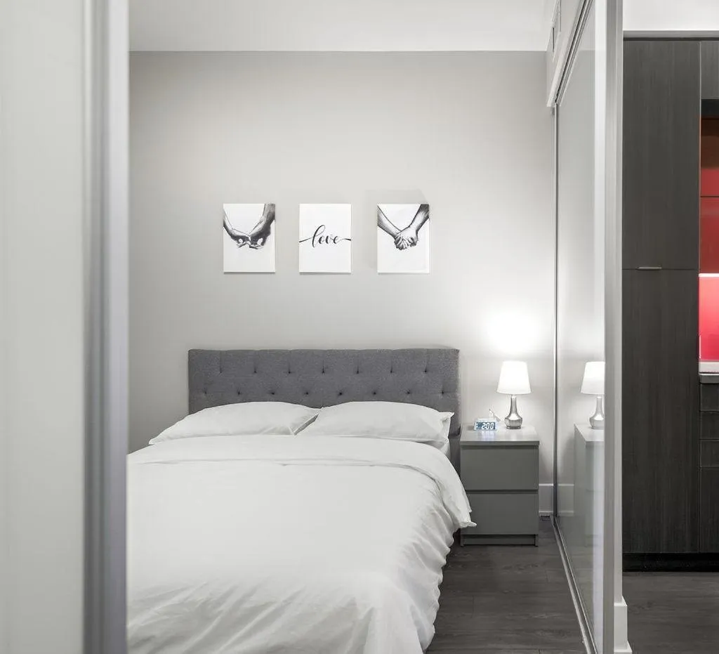 Photo of the whole room, Bed in Skyline Suites - Walk to MTCC, ACC, Rogers Centre & Entertainment District