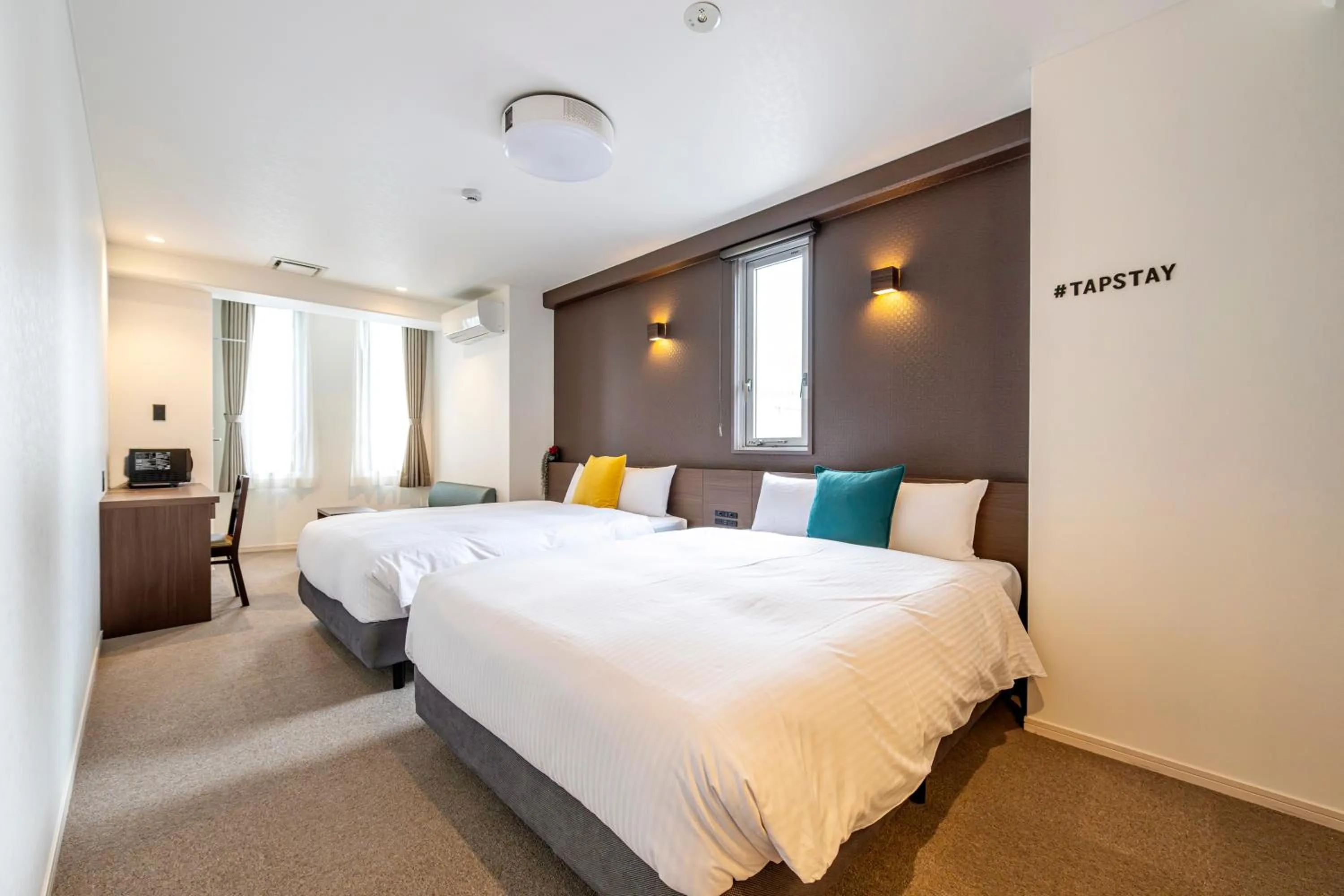 Bed in TapStay Hotel