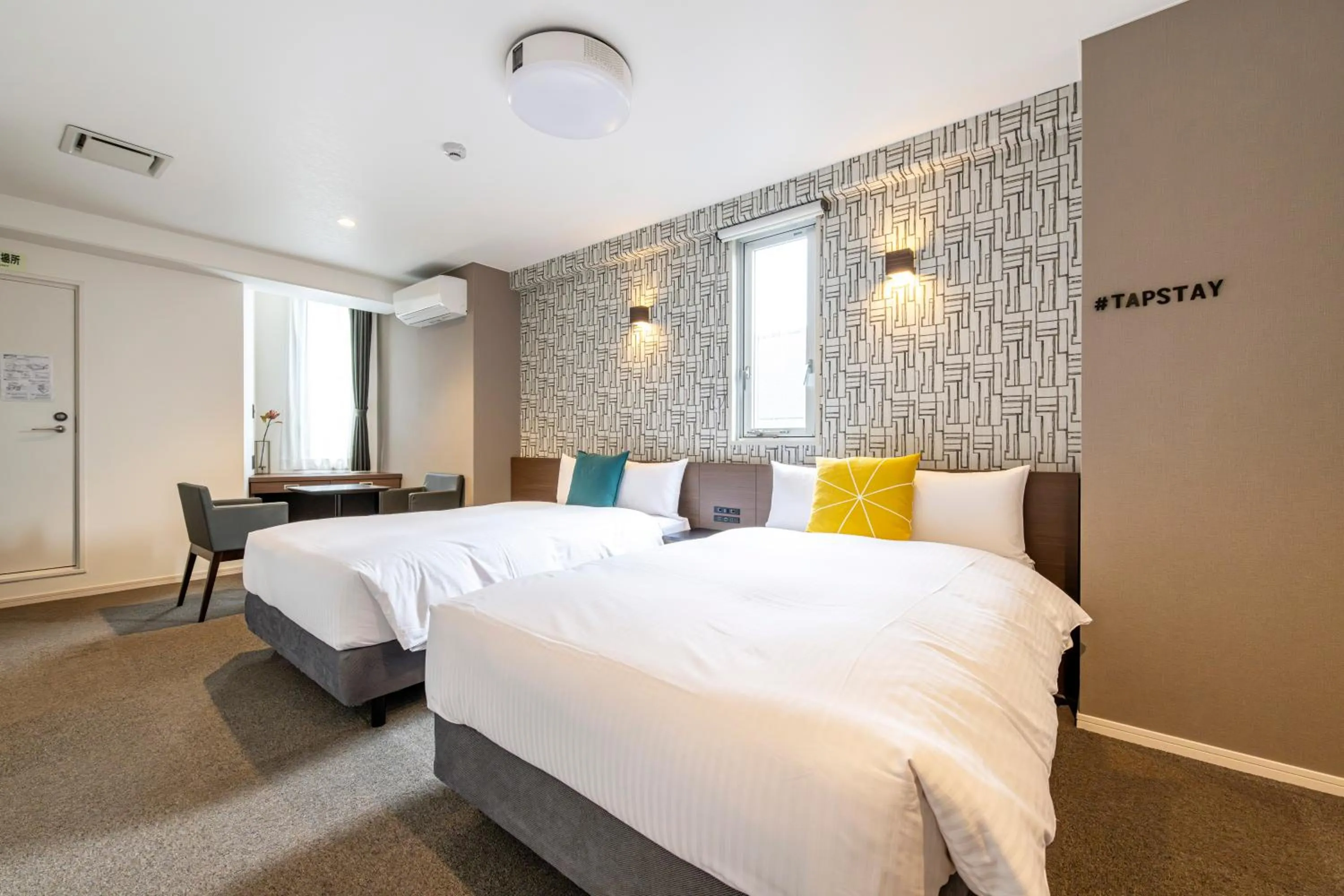 Bed in TapStay Hotel