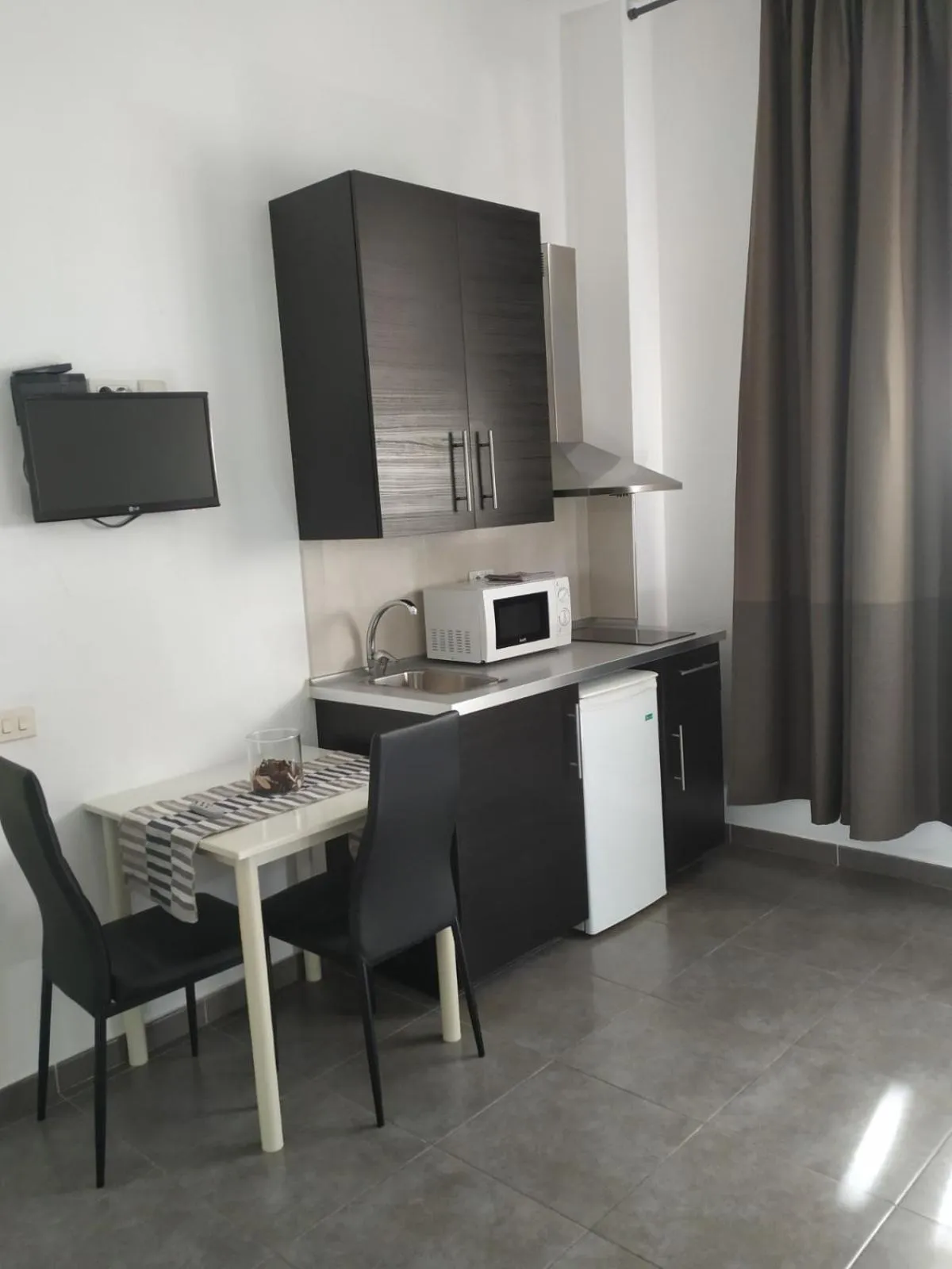 Kitchen or kitchenette in Apartamentos El Patio