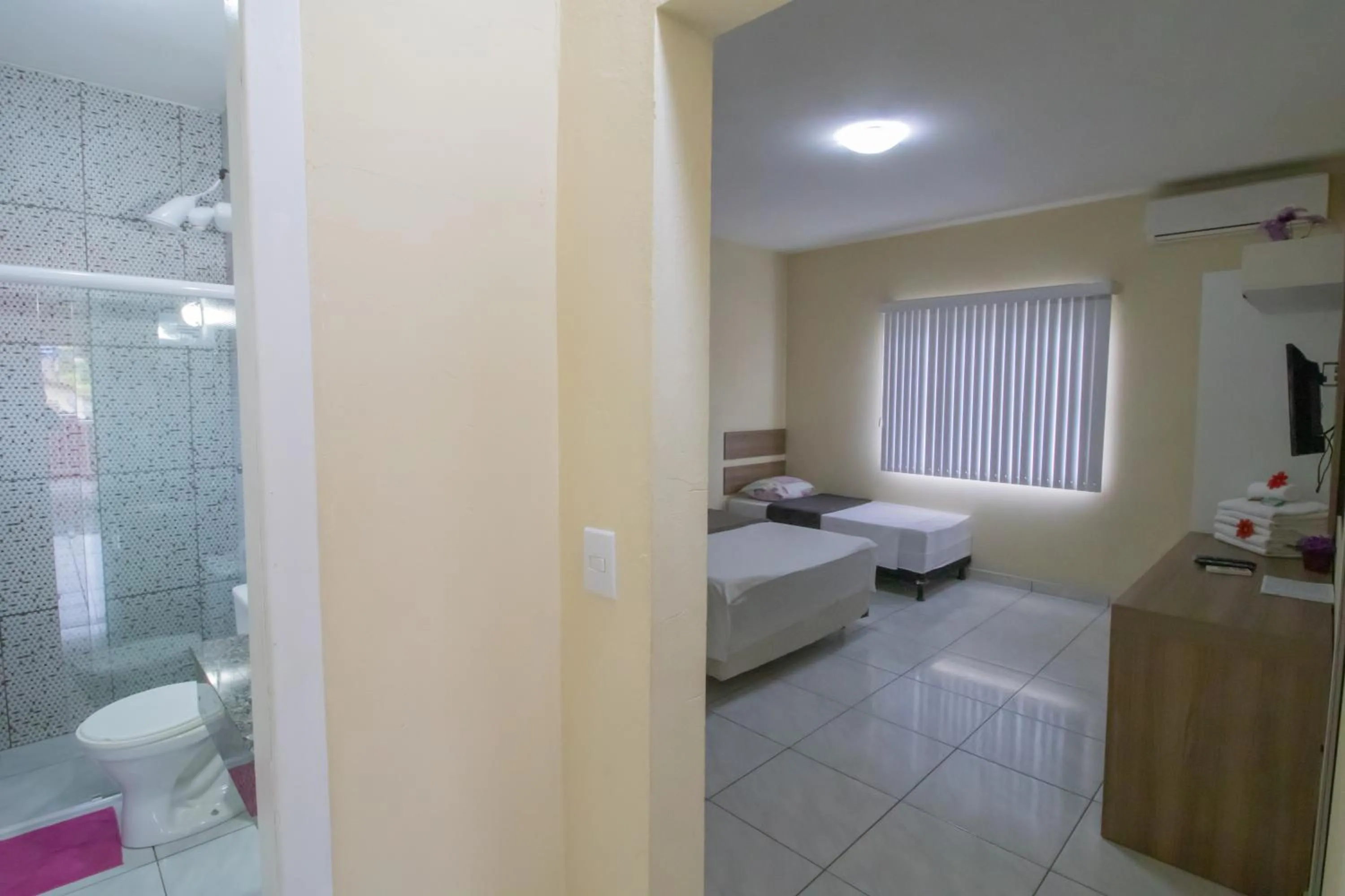 Bed in Pousada Vovó Dilma