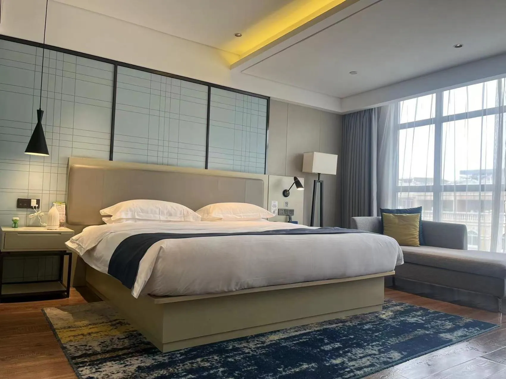 Bedroom, Bed in Echarm Hotel Wuzhou Canghai Lake High Speed Railway Station
