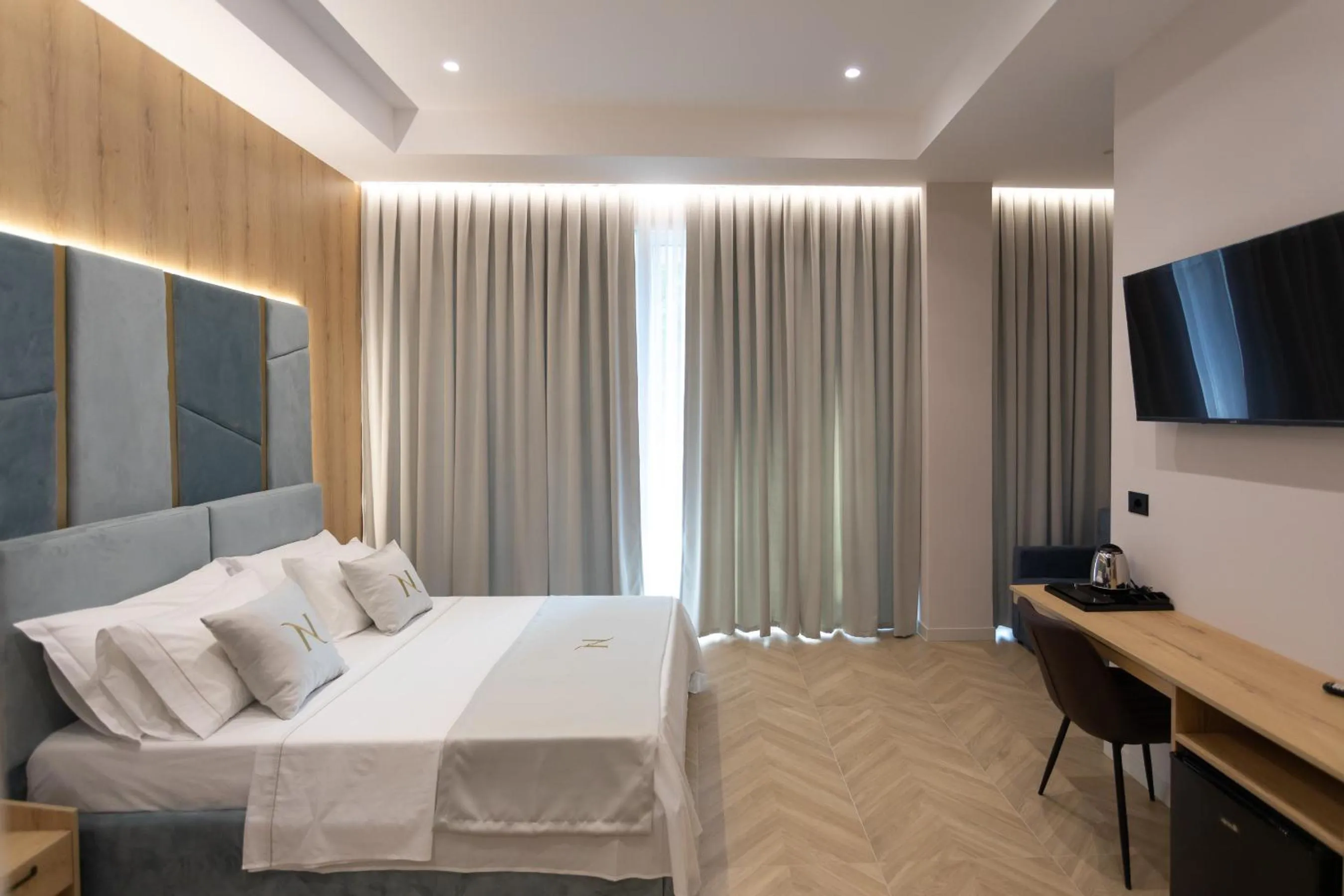 Communal lounge/ TV room, Bed in Nayel Hotel