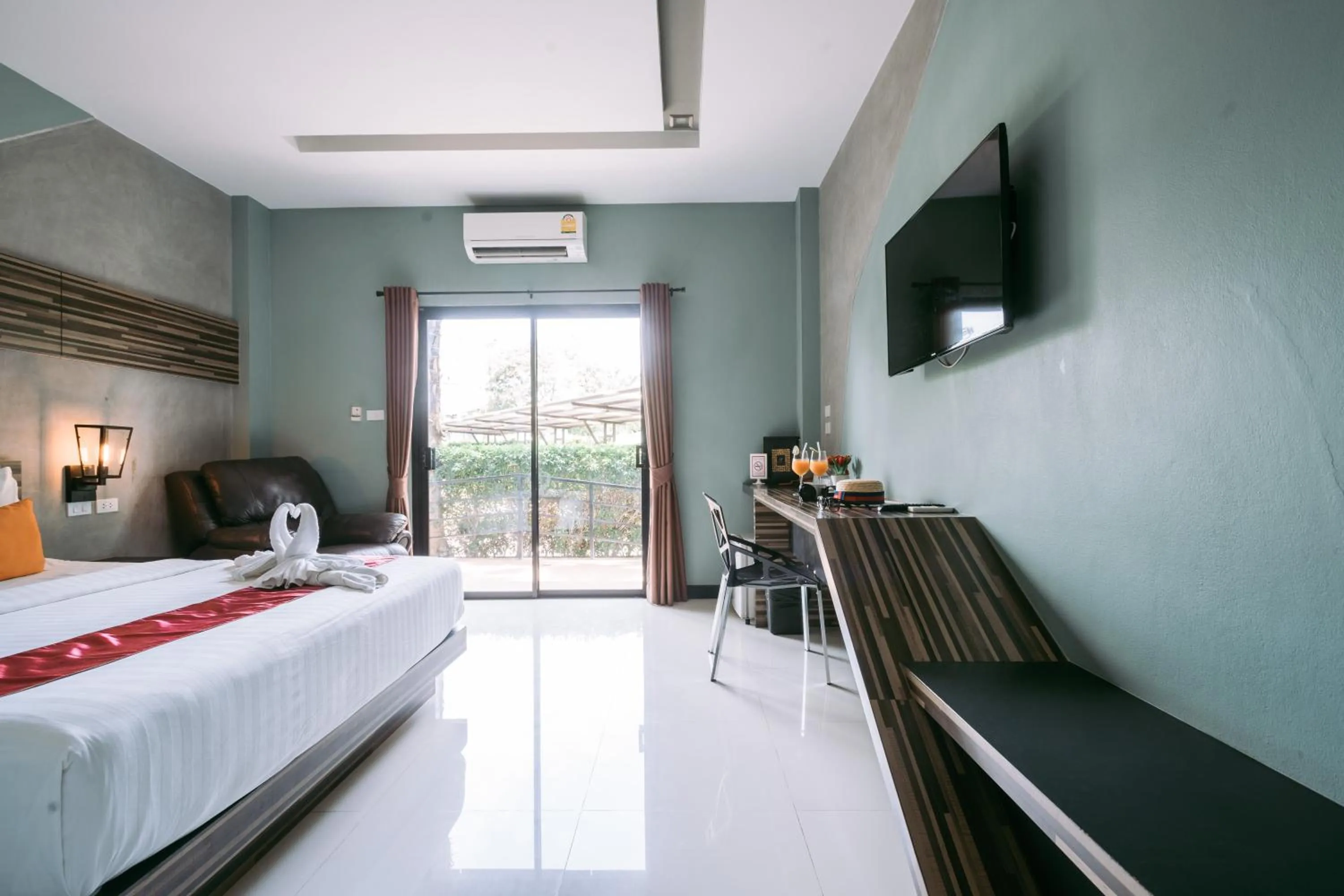 Photo of the whole room, Bed in Ray Hotel Buriram