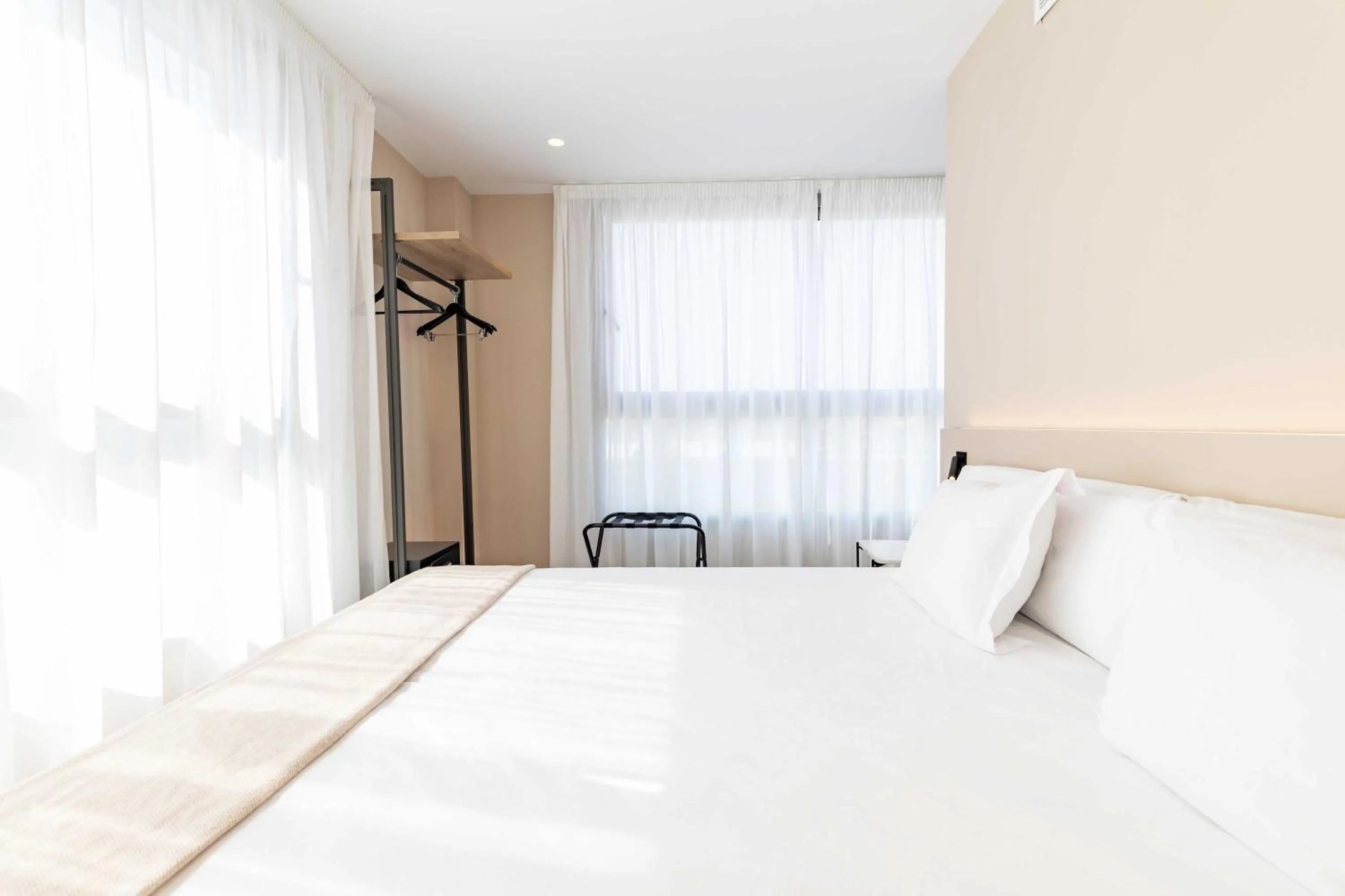Bed in HQ Arena Hotel