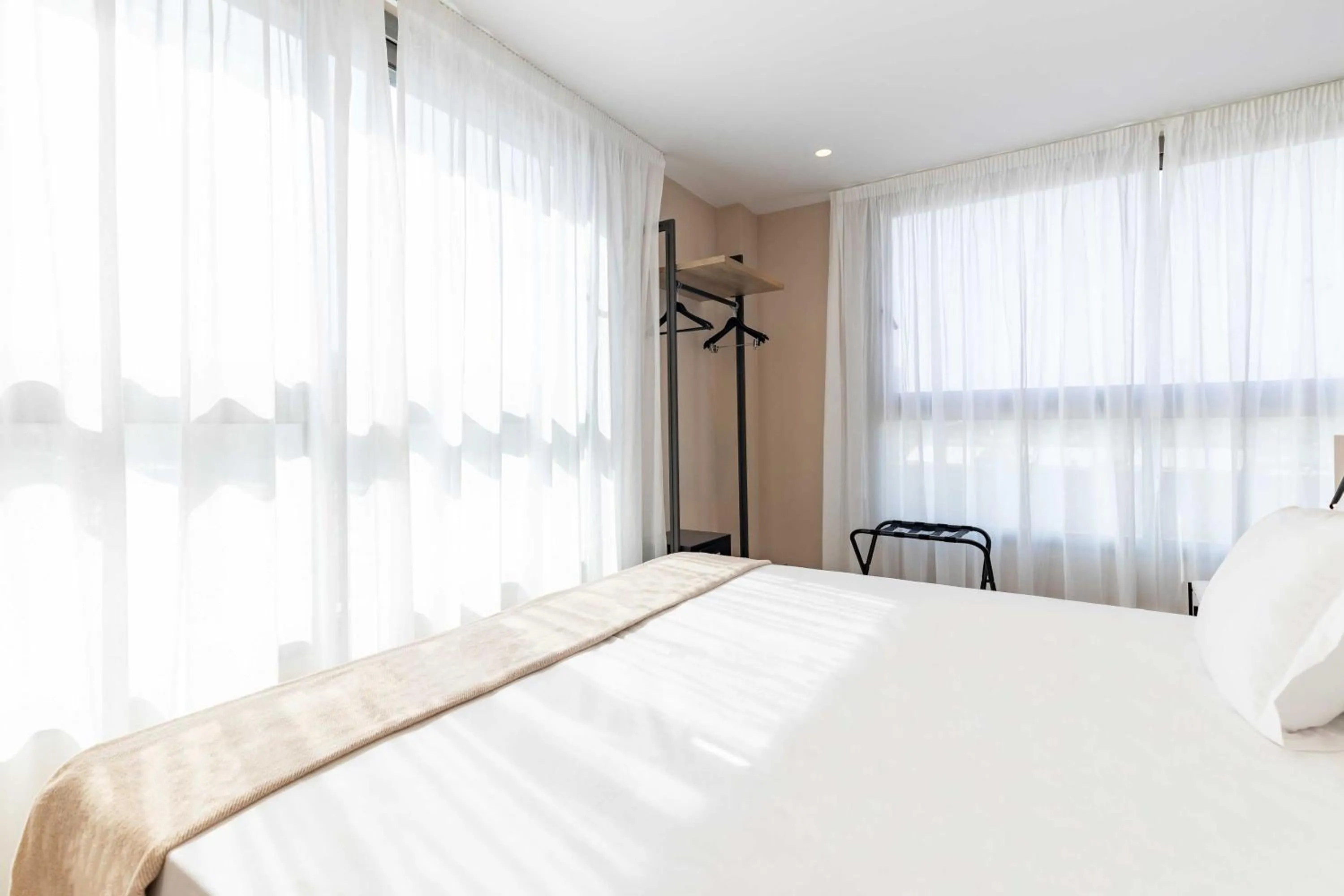 Bed in HQ Arena Hotel