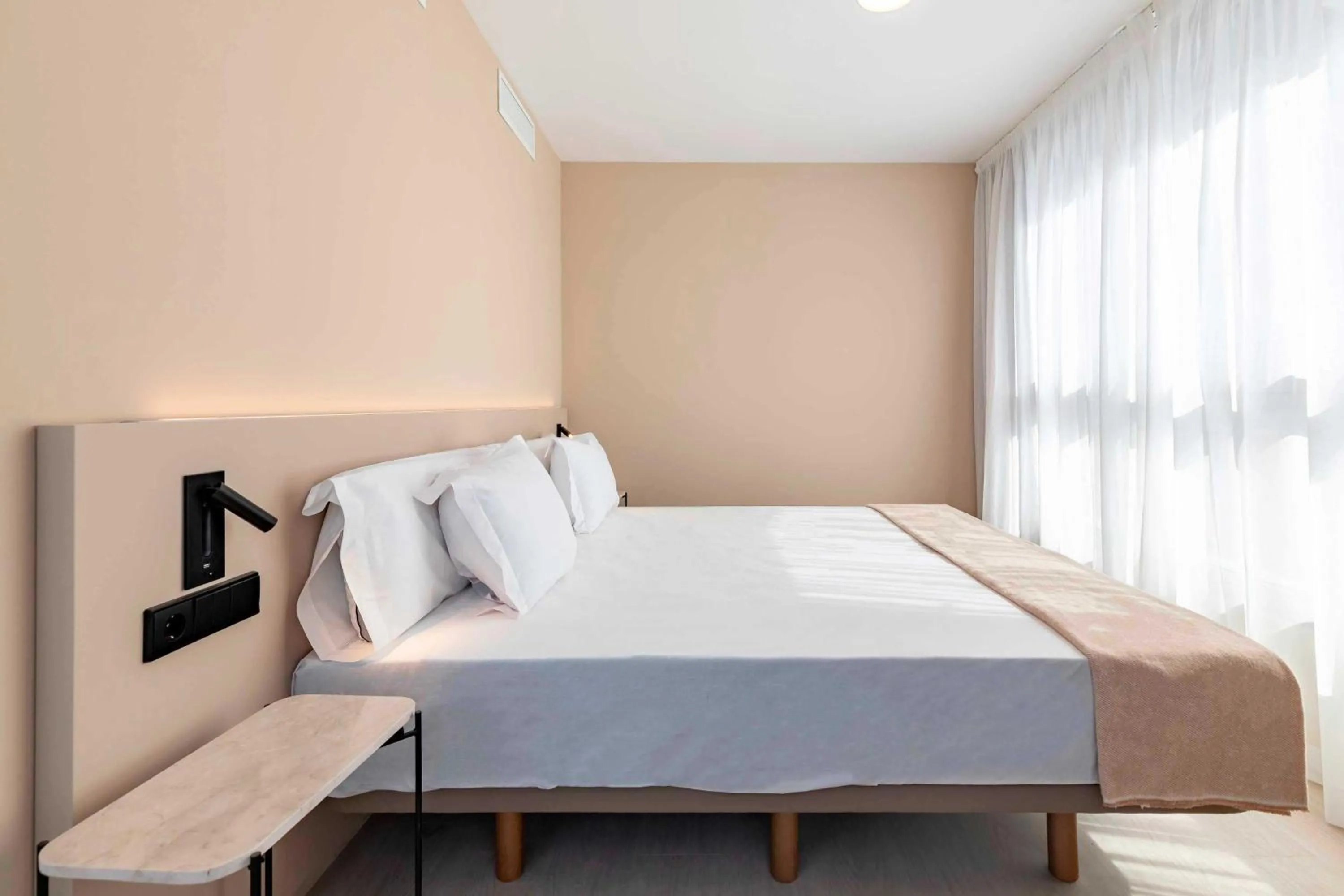 Bed in HQ Arena Hotel