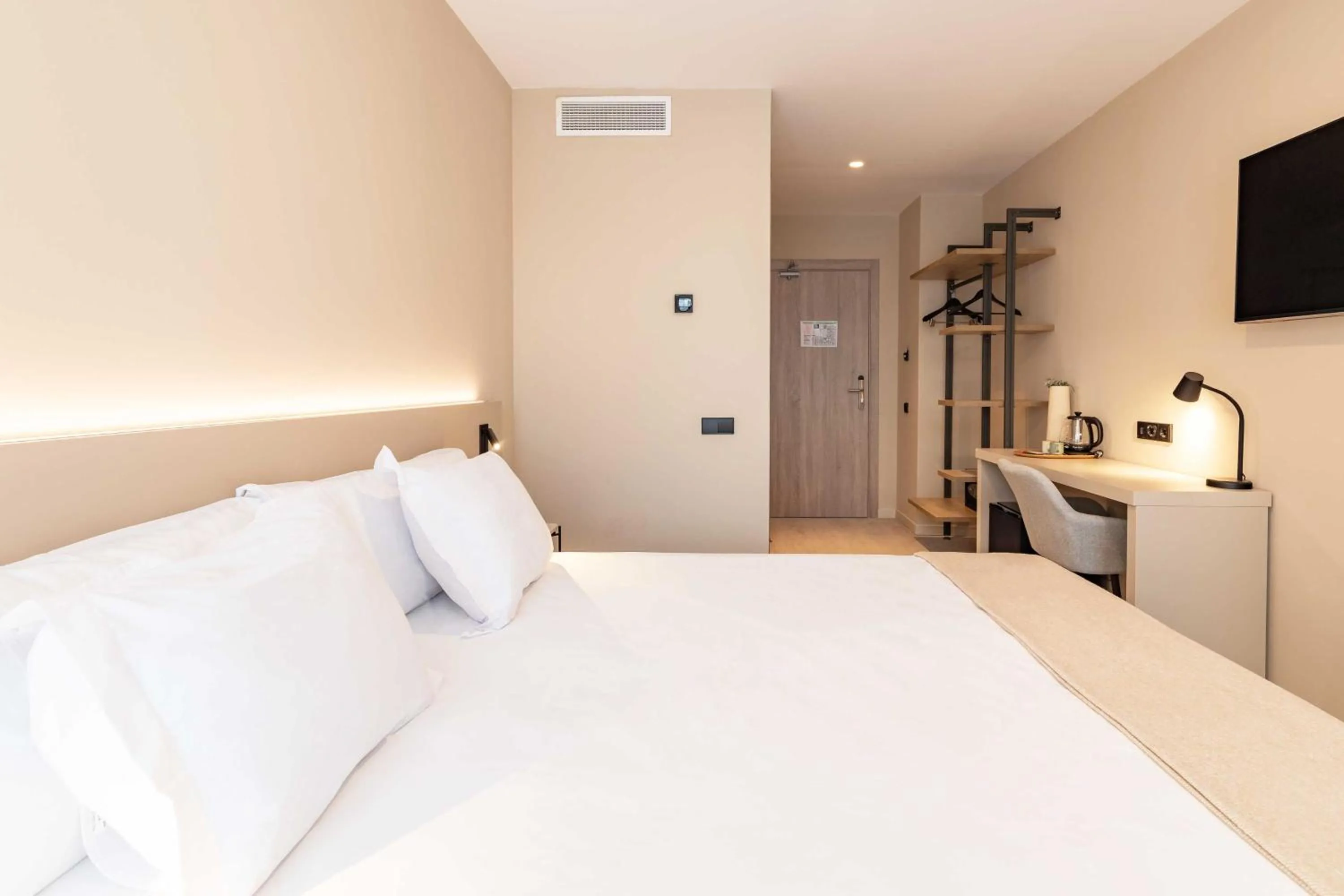 Bed in HQ Arena Hotel