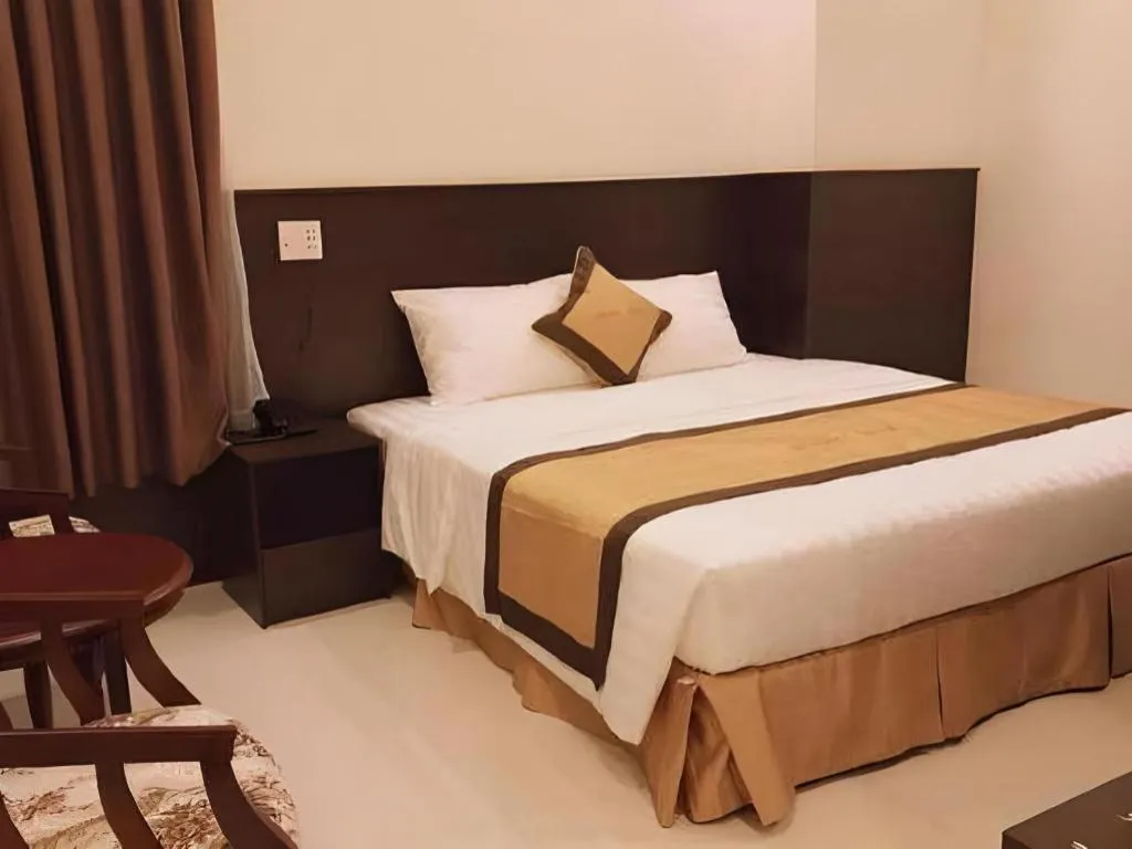 Bed in LUCKY STAR HOTEL