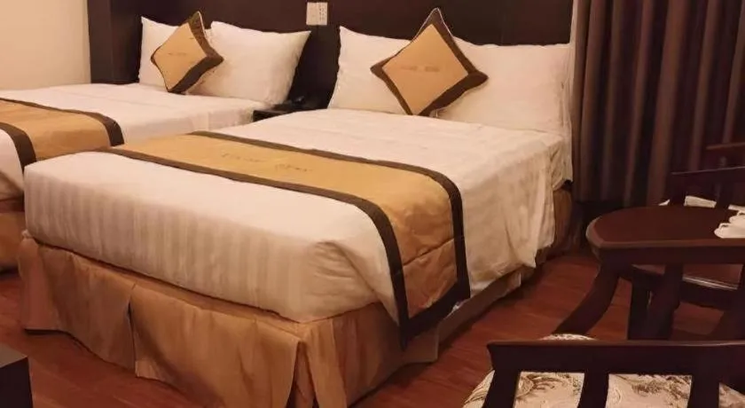 Bed in LUCKY STAR HOTEL