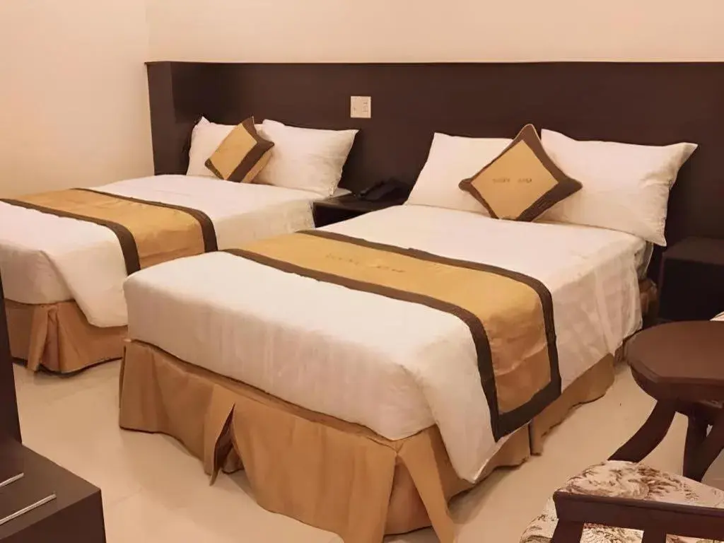 Bed in LUCKY STAR HOTEL Bed in LUCKY STAR HOTEL