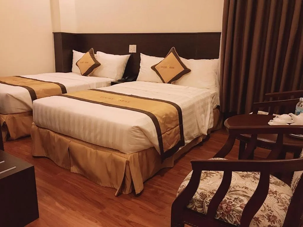 Bed in LUCKY STAR HOTEL