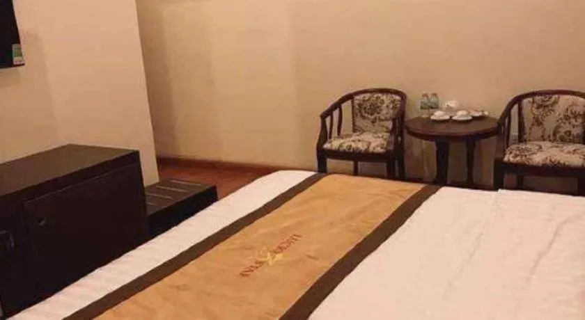 Bed in LUCKY STAR HOTEL