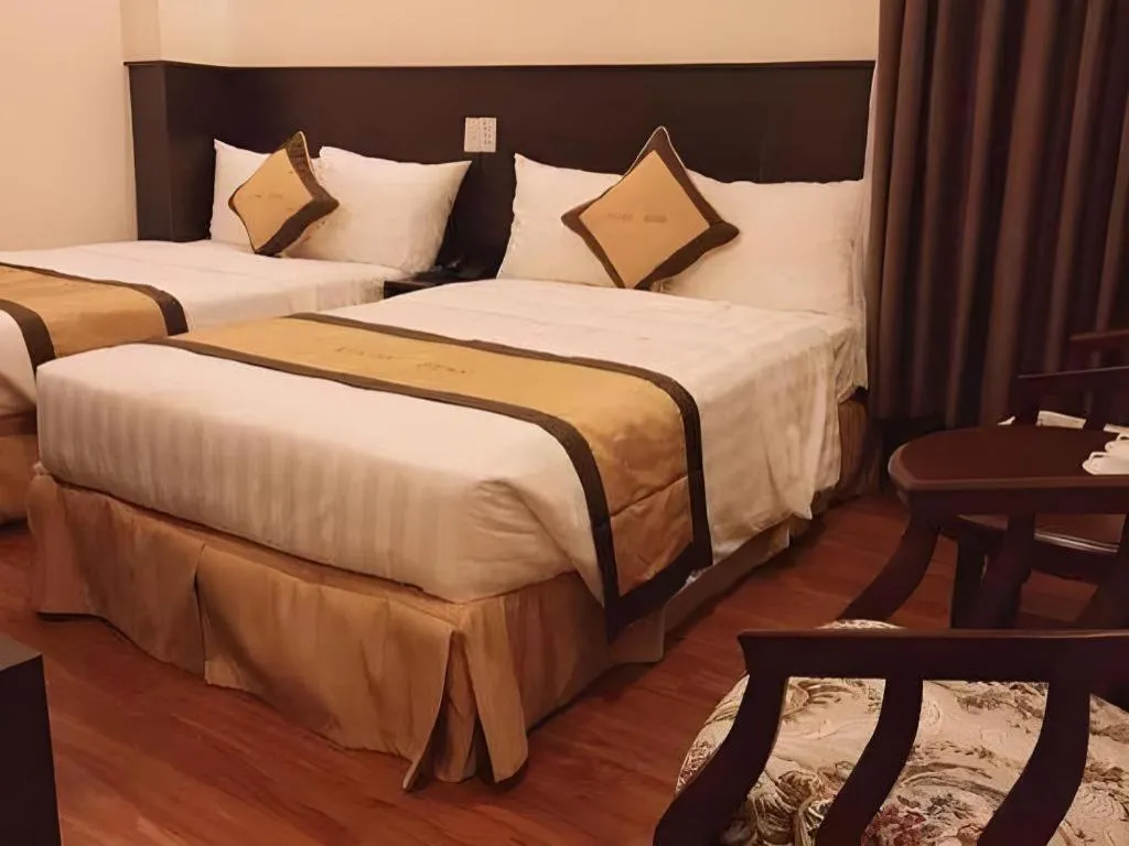 Bed in LUCKY STAR HOTEL