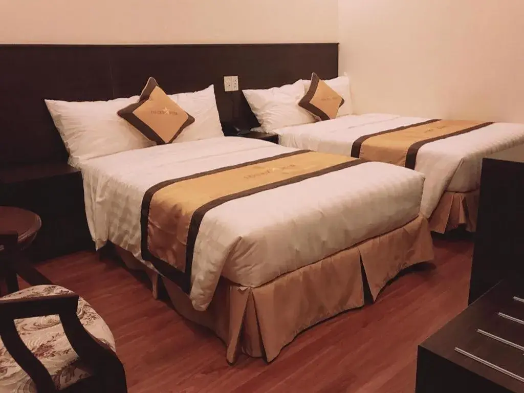 Bed in LUCKY STAR HOTEL Bed in LUCKY STAR HOTEL