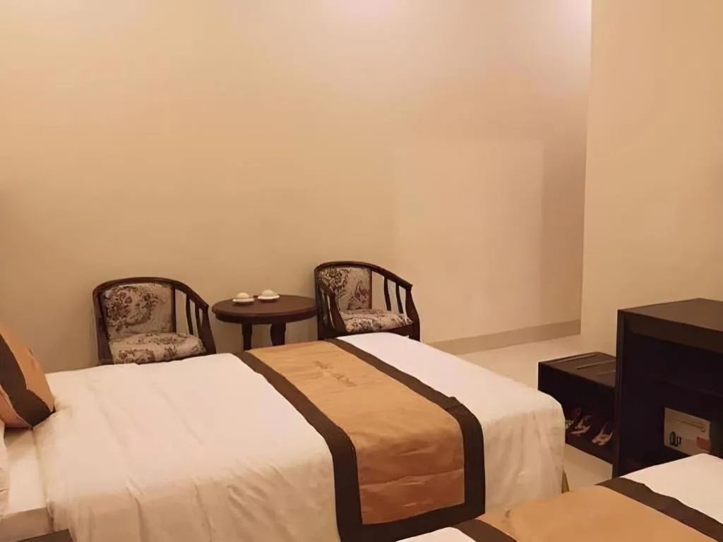 Bed in LUCKY STAR HOTEL