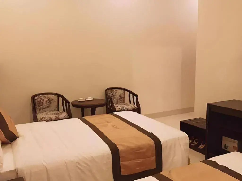 Bed in LUCKY STAR HOTEL Bed in LUCKY STAR HOTEL