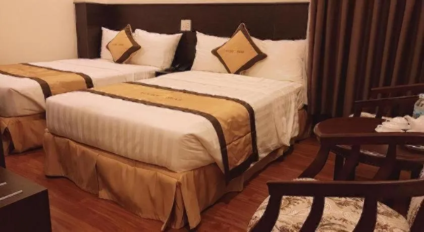 Bed in LUCKY STAR HOTEL