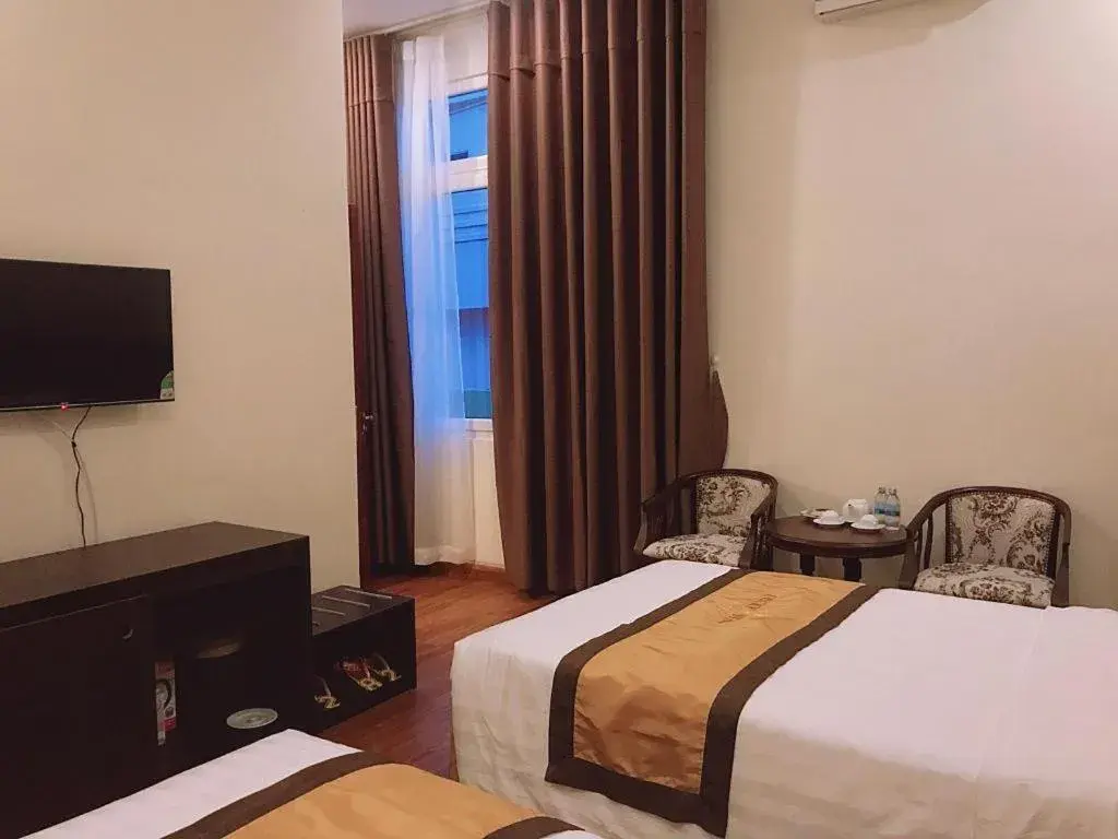 Bed in LUCKY STAR HOTEL Bed in LUCKY STAR HOTEL