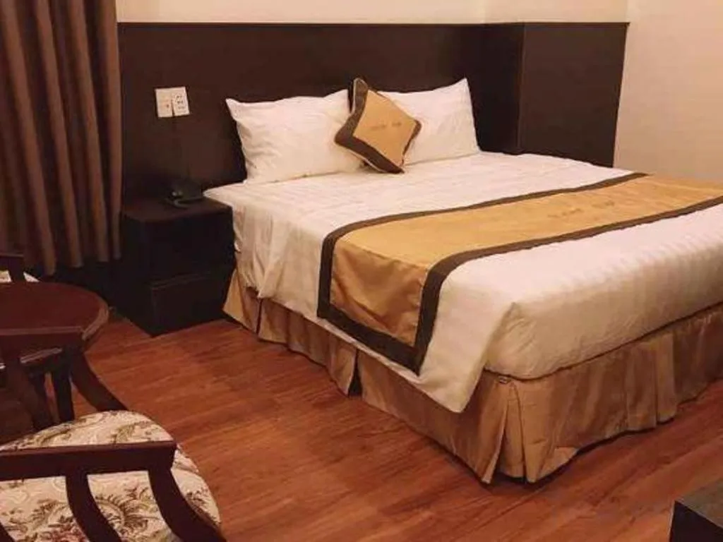 Bed in LUCKY STAR HOTEL