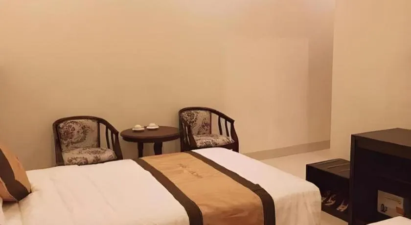 Bed in LUCKY STAR HOTEL