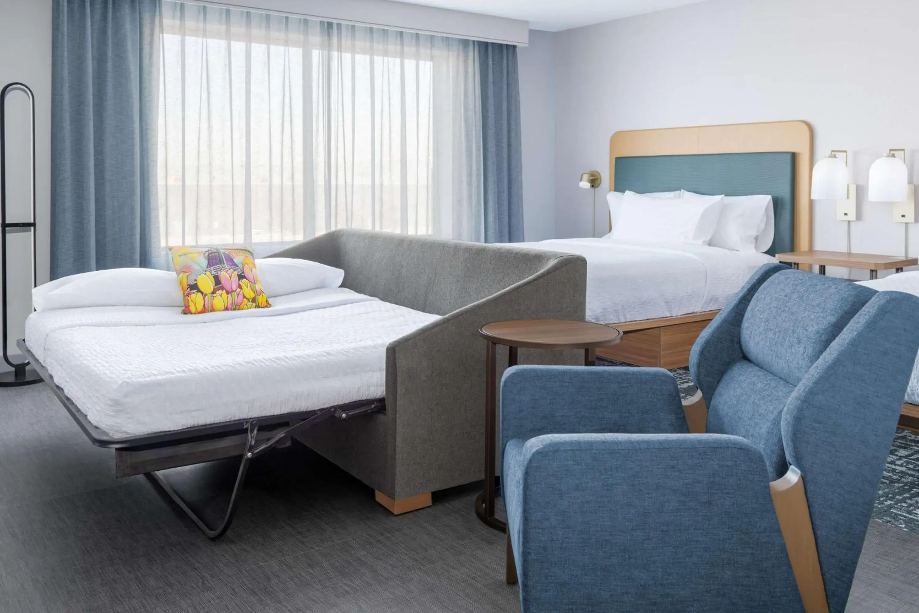 Living room, Bed in Homewood Suites By Hilton Holland Living room, Bed in Homewood Suites By Hilton Holland