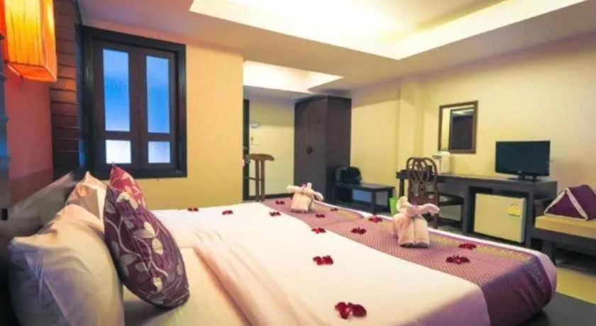 Bed in Wild Orchid Villa Krabi