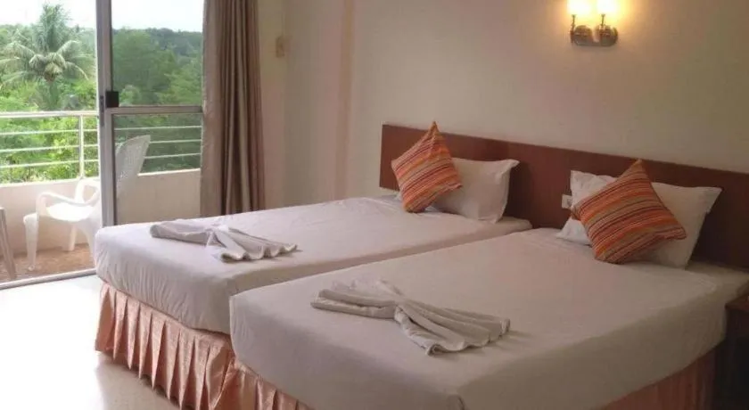 Bed in Wild Orchid Villa Krabi