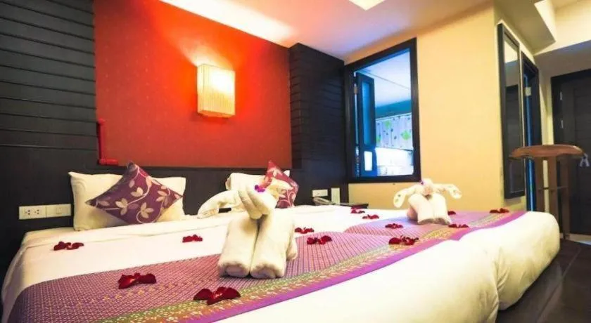 Bed in Wild Orchid Villa Krabi