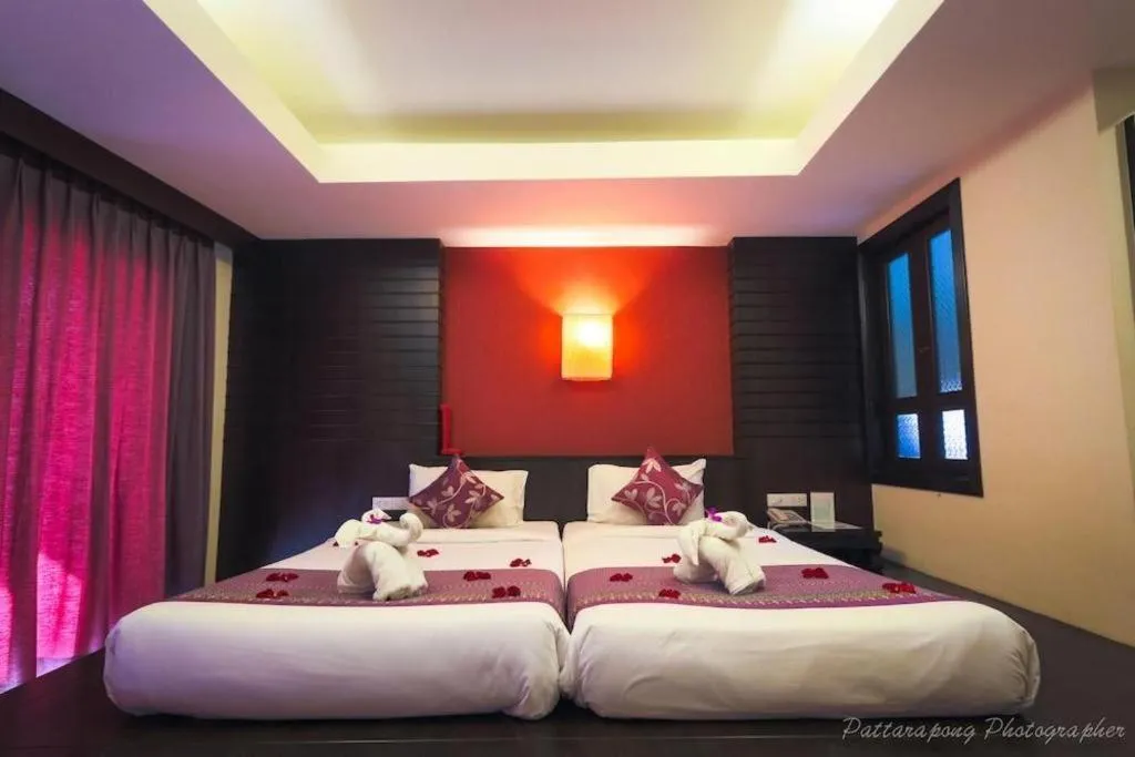 Bed in Wild Orchid Villa Krabi