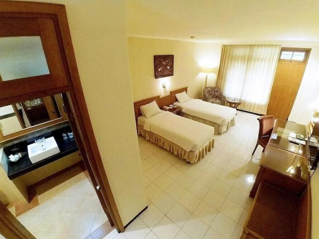 Bed in Purnama Hotel